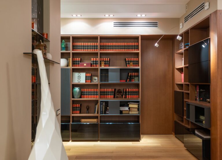 Best bookshelf: an open bookshelf with books in a living room