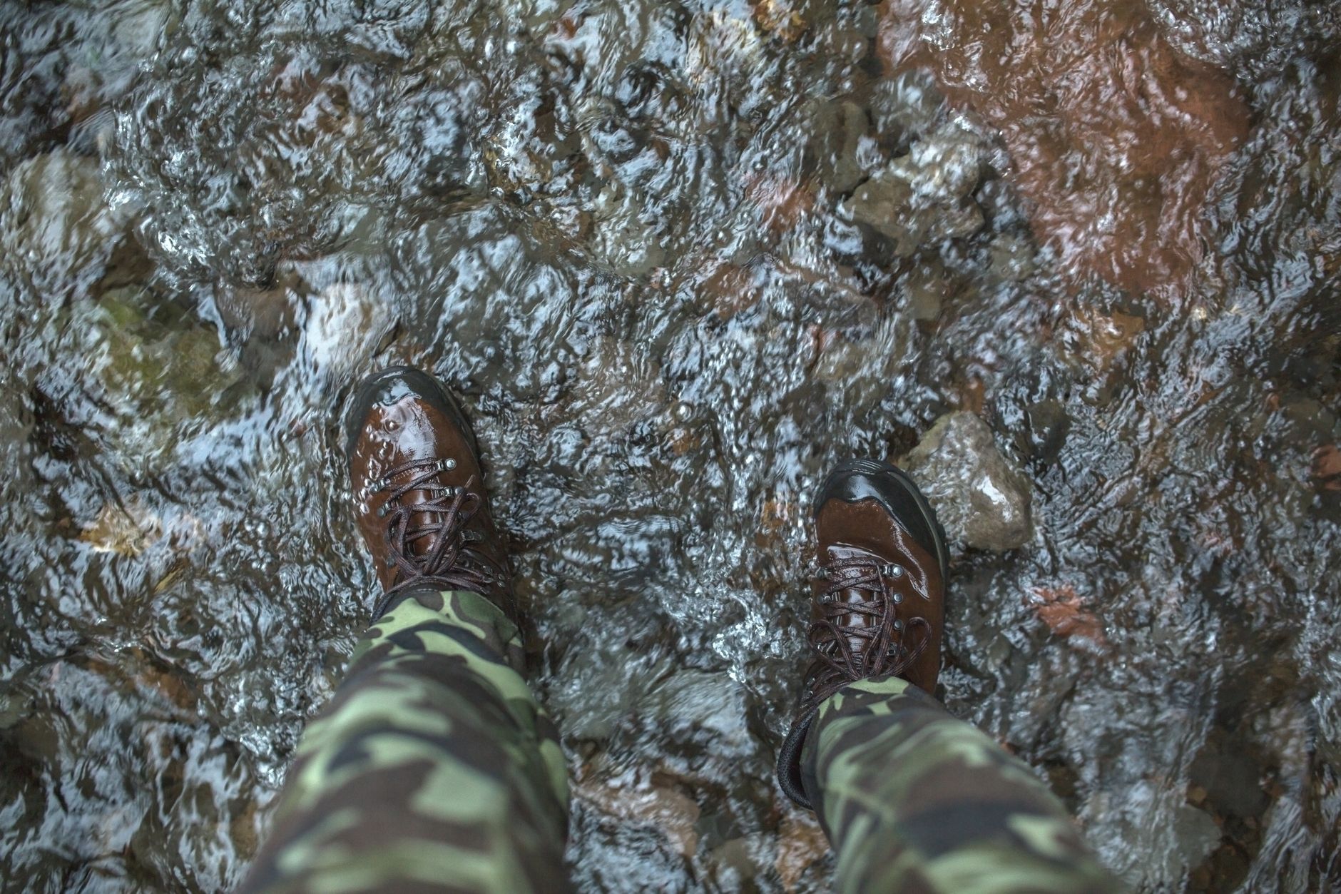 A pair of wet hiking boots