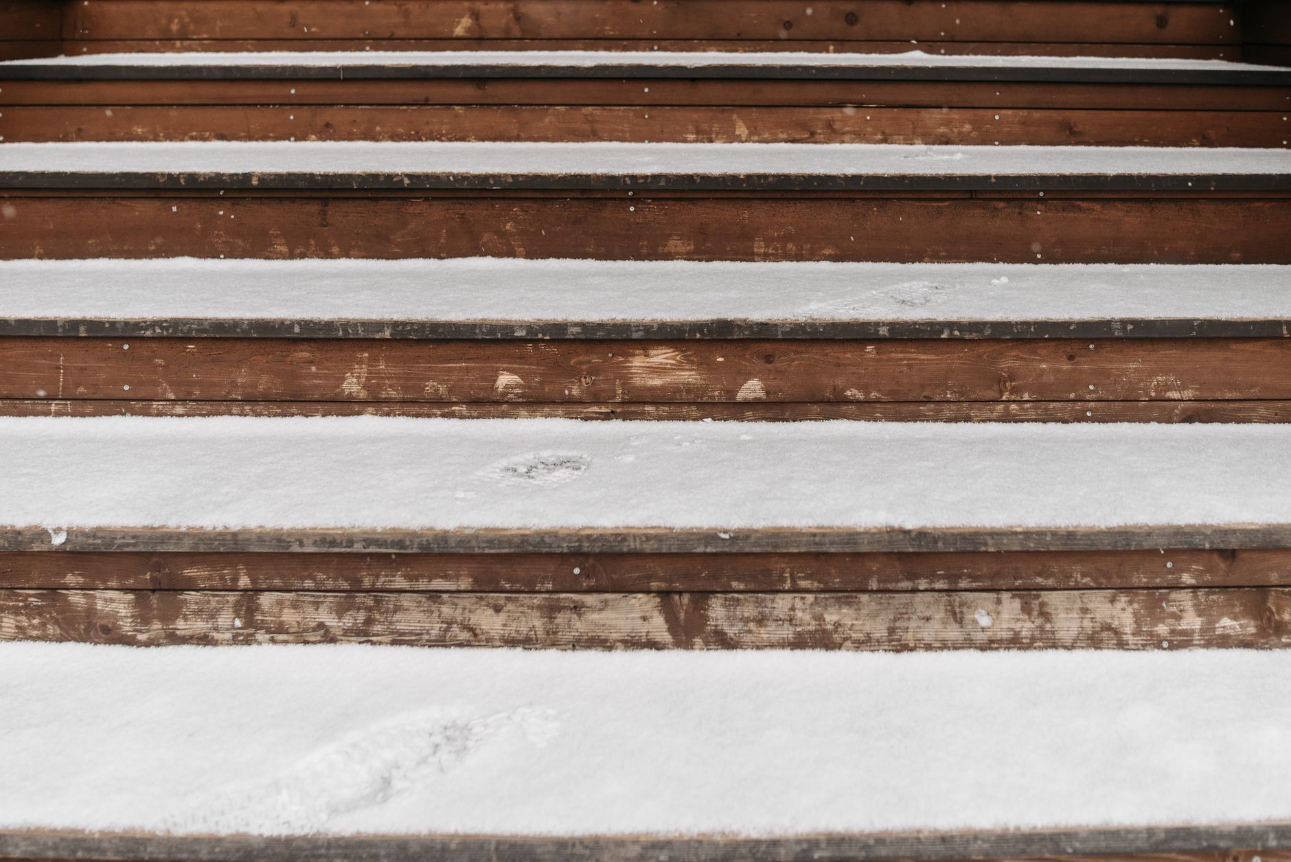 Snow on the front steps of a house