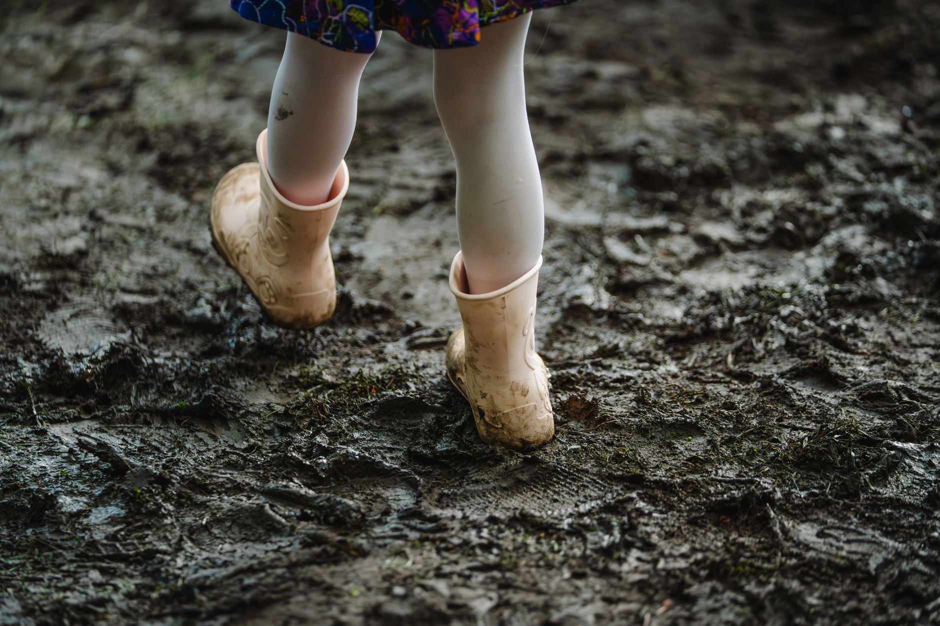 Muddy boots near a doorway
