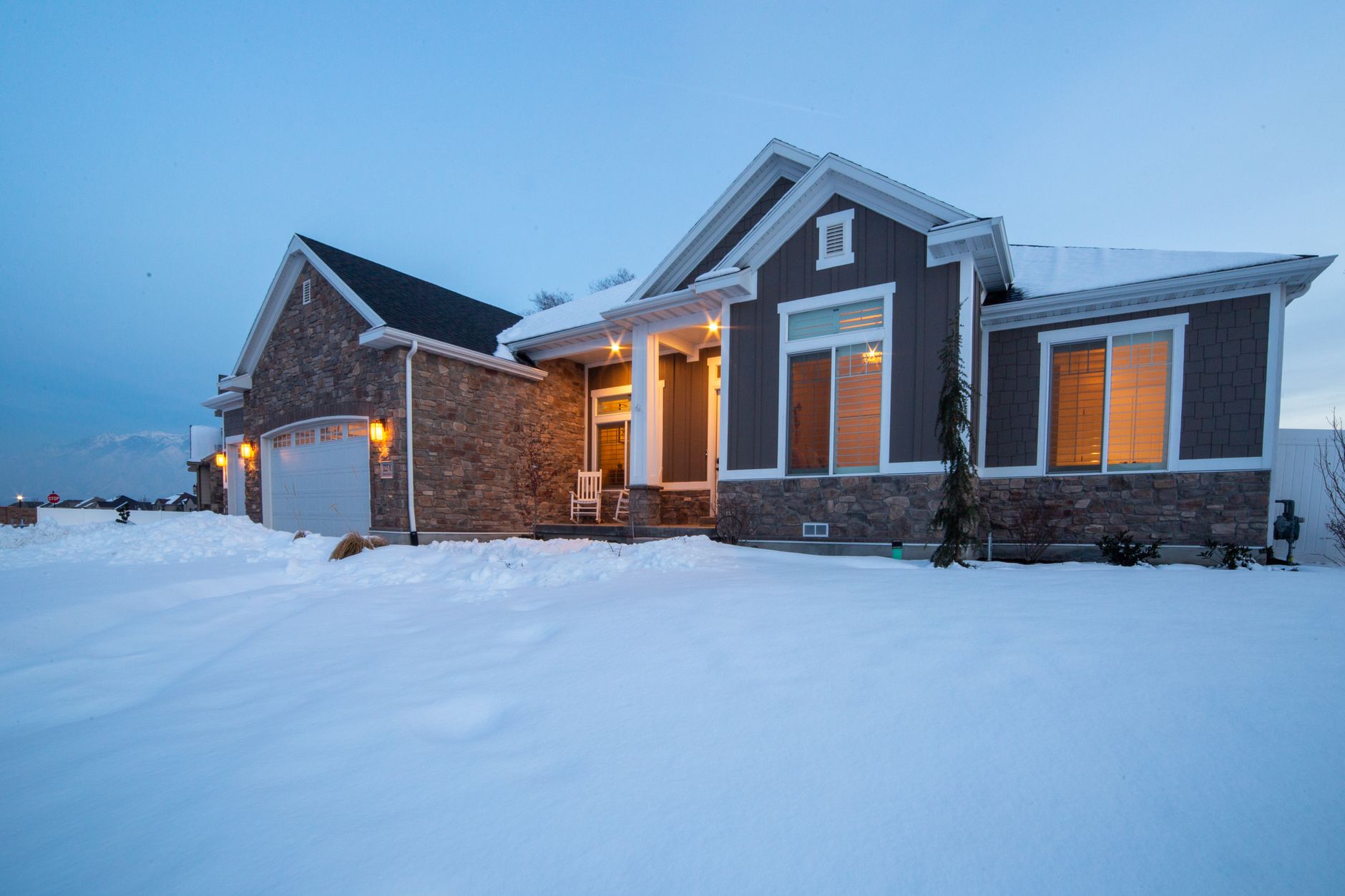 A snowy front porch outside a house