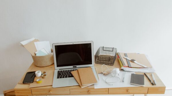 Best cable management: a laptop and supplies on a small wooden desk