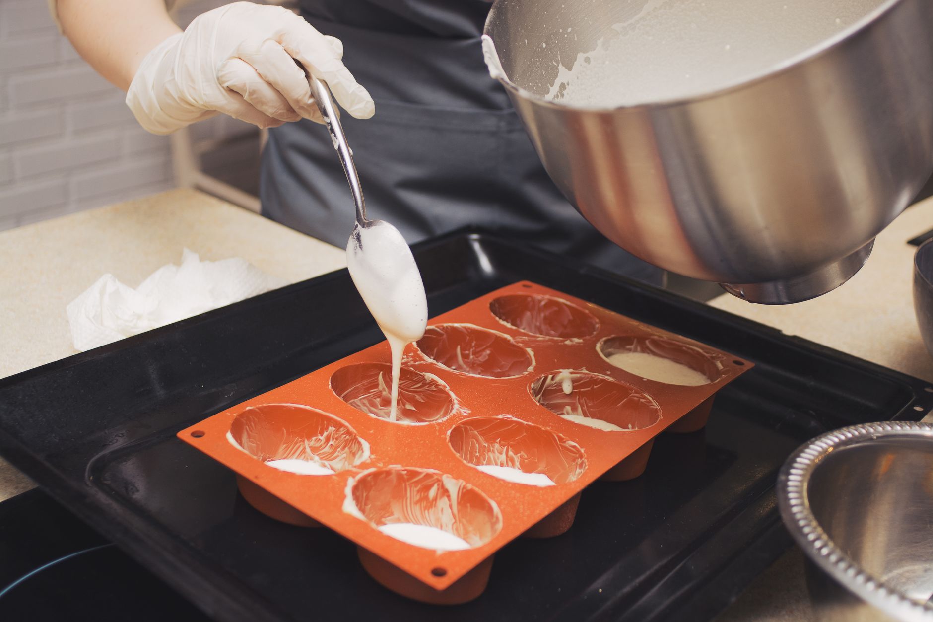 Cake batter being poured into a baking pan