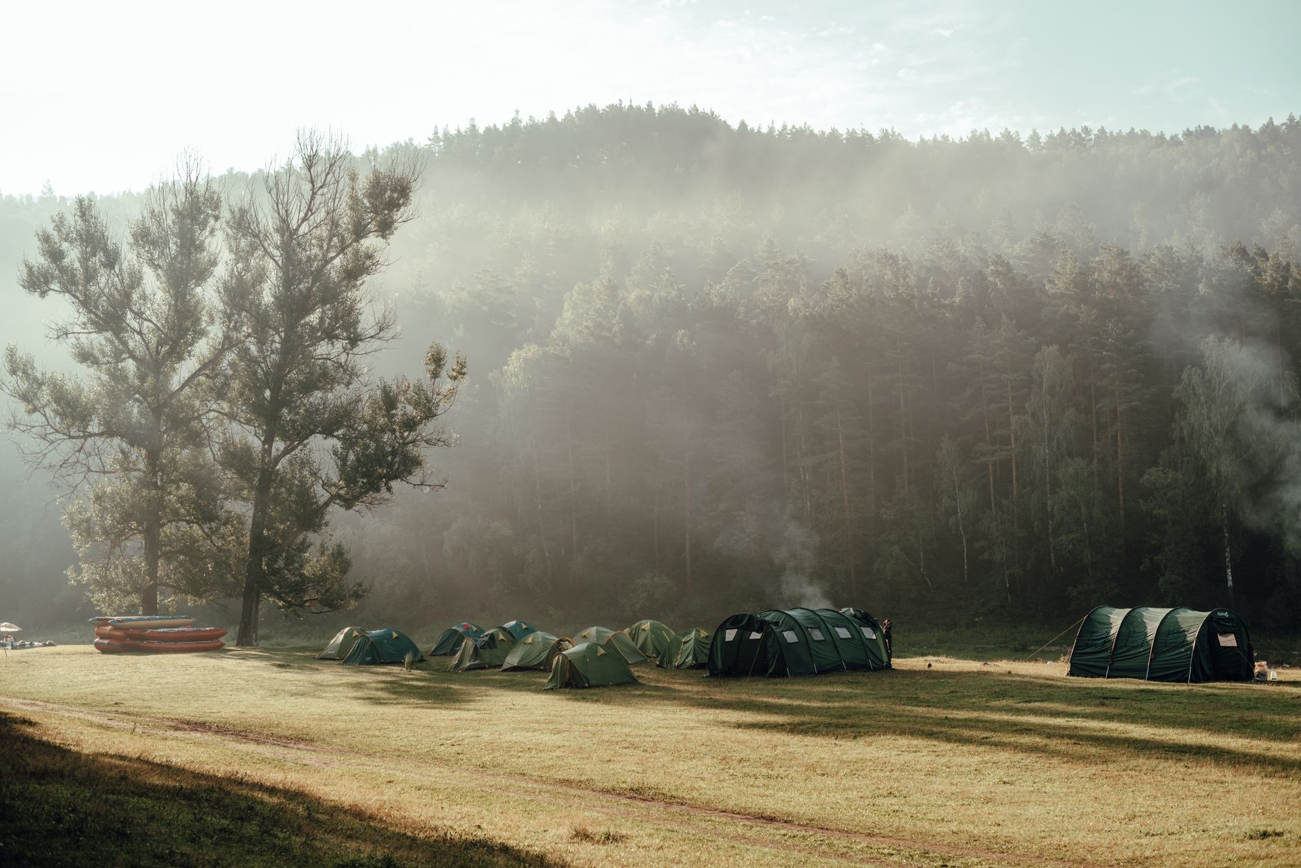 A tent pitched at a forest campsite