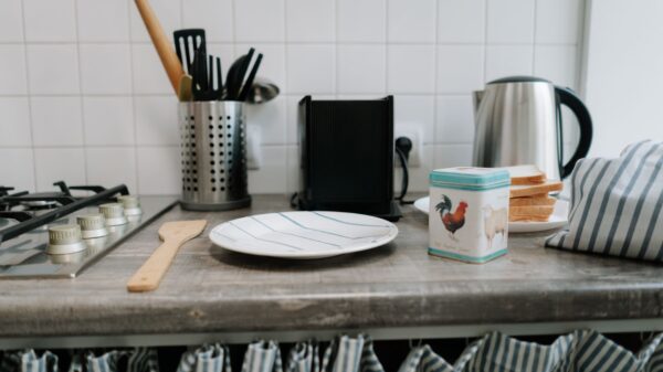 Kitchen utensils and a kettle on a counter