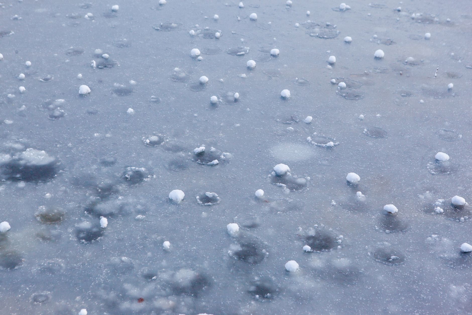 Hailstones on a car surface