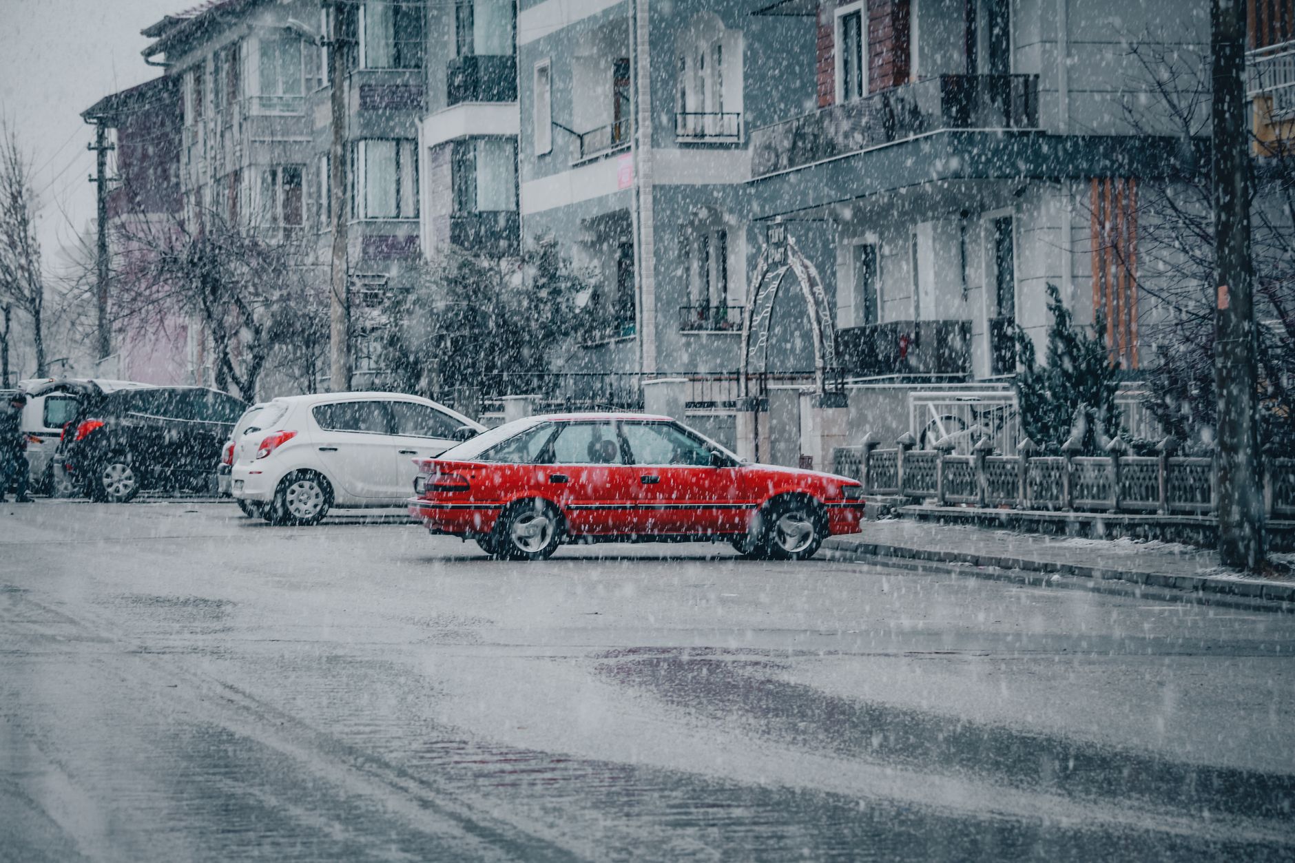 Cars on a snow-covered road in winter