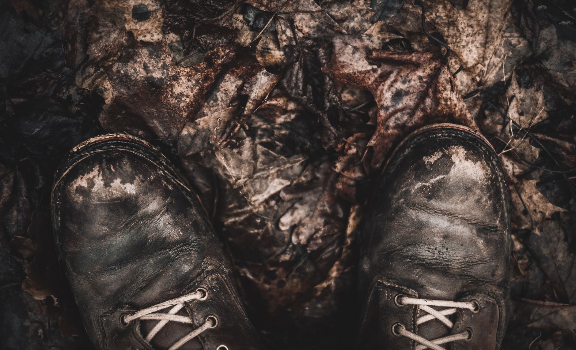 Muddy boots on a wet path