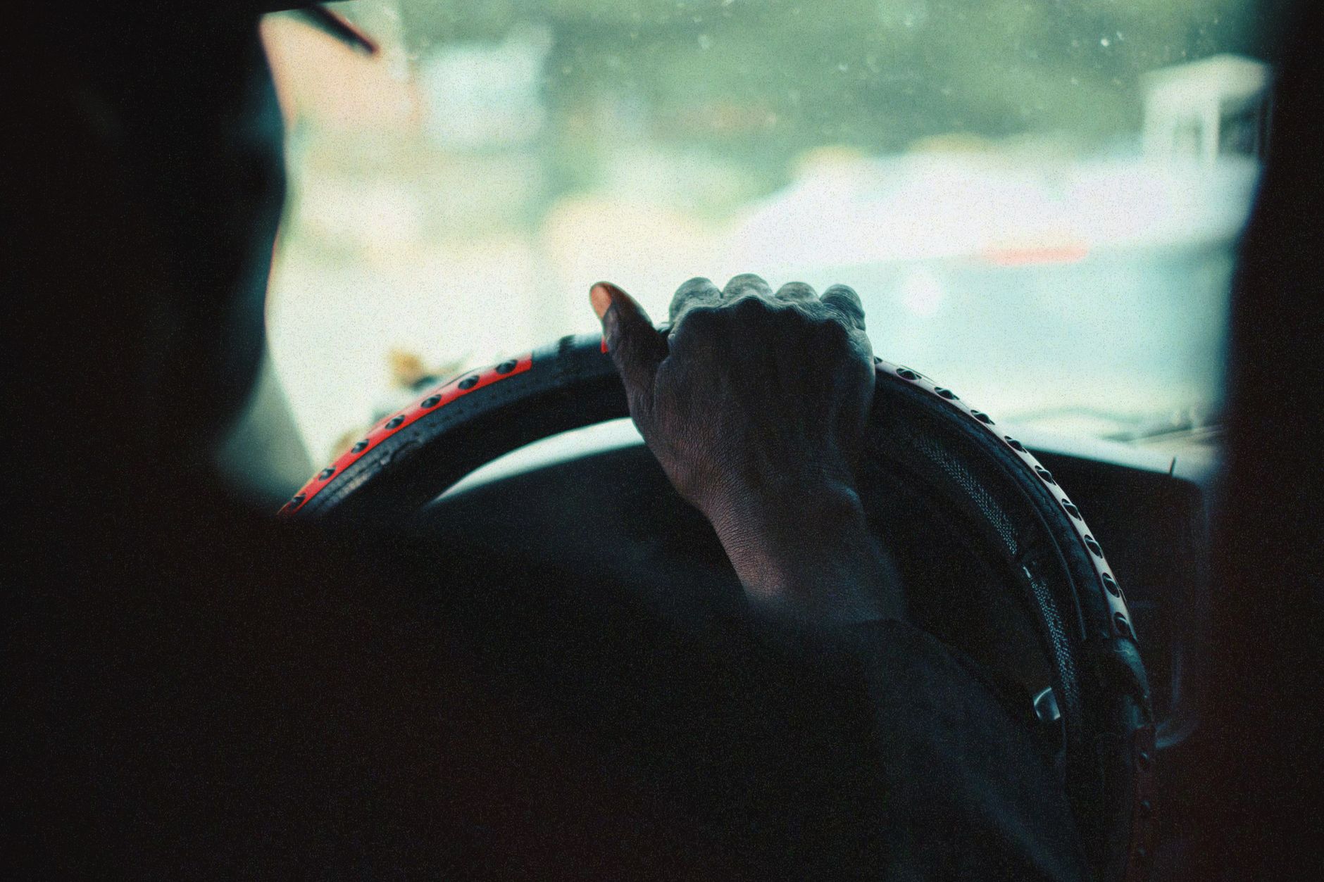 A driver holding the steering wheel
