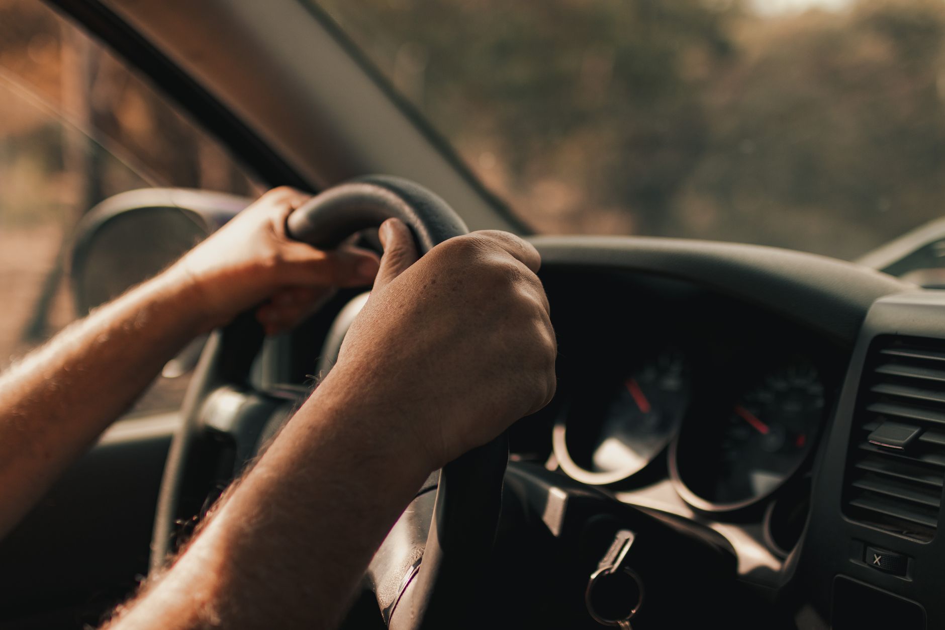 Hands on a steering wheel