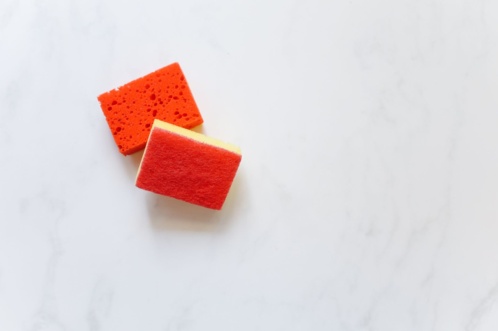 A bucket and sponge for a hand car wash