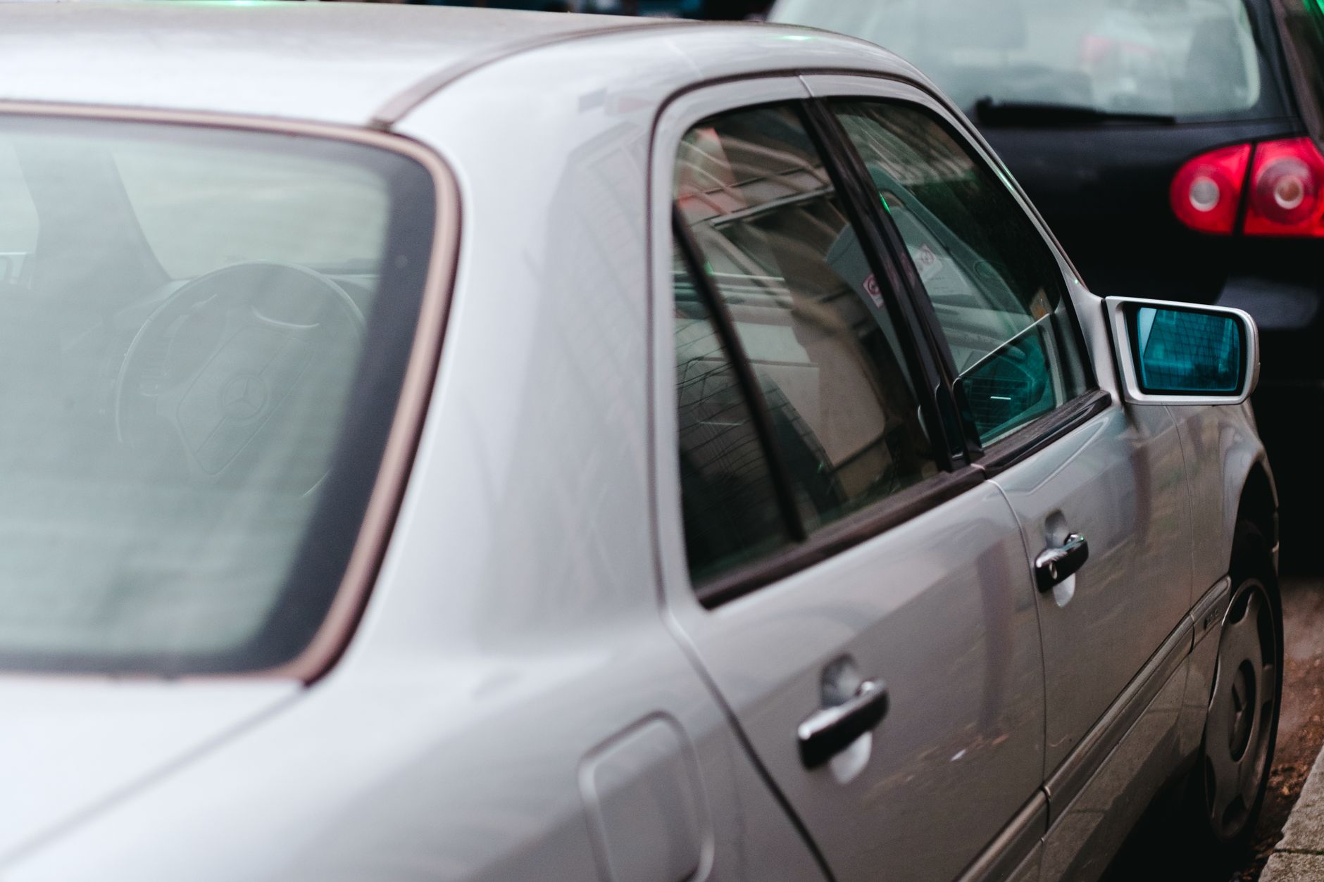 The side windows of a silver car