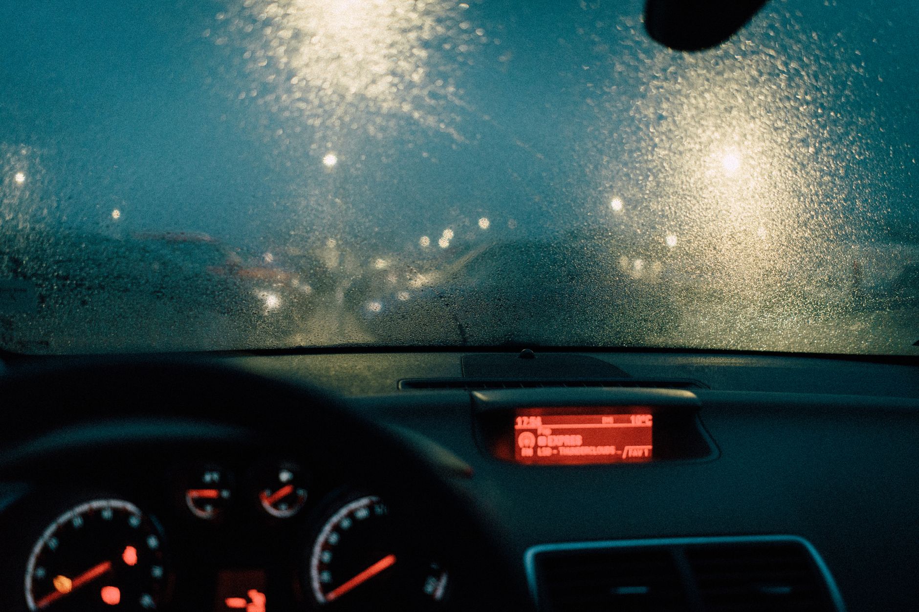Rain on a windshield at night
