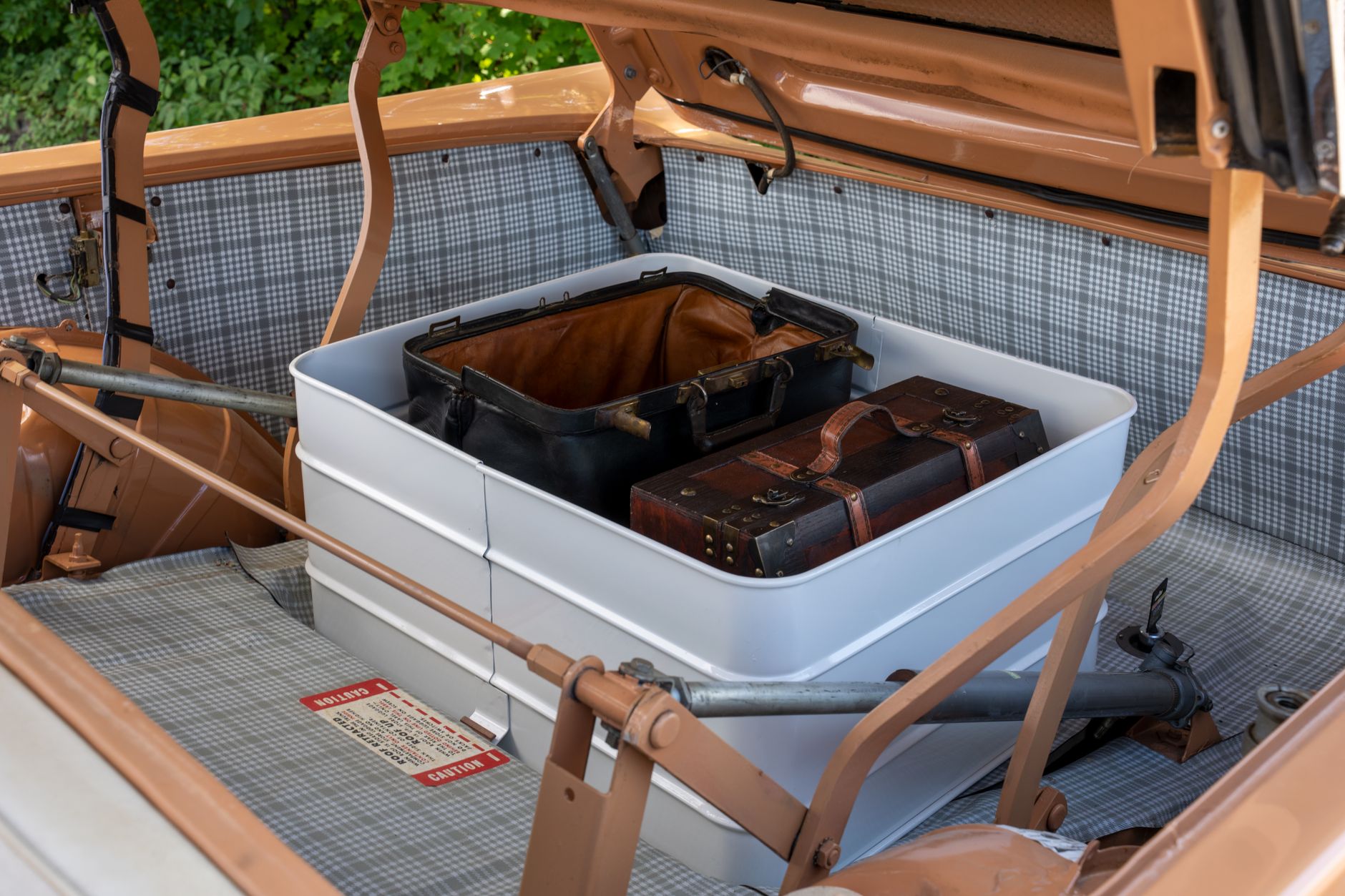 Luggage being loaded into a vehicle for a trip