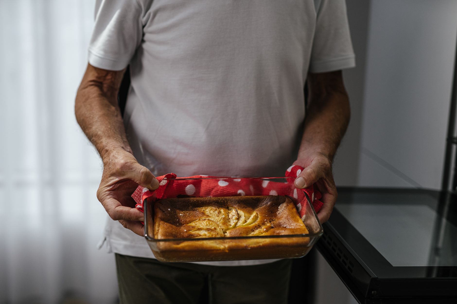 A glass baking dish on a kitchen counter