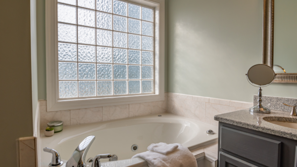 Best caulk gun: a jetted tub and vanity in a bright bathroom