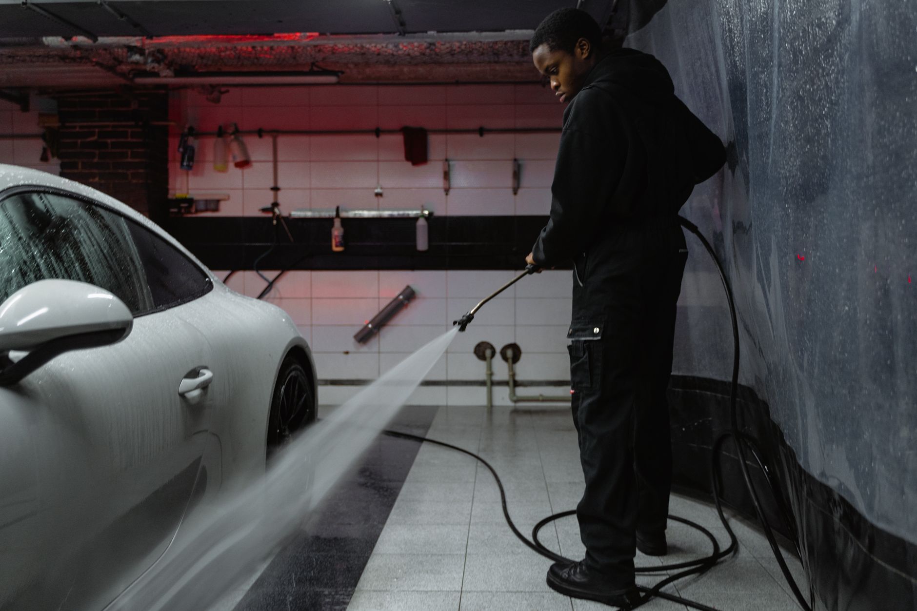 Washing a car in a garage