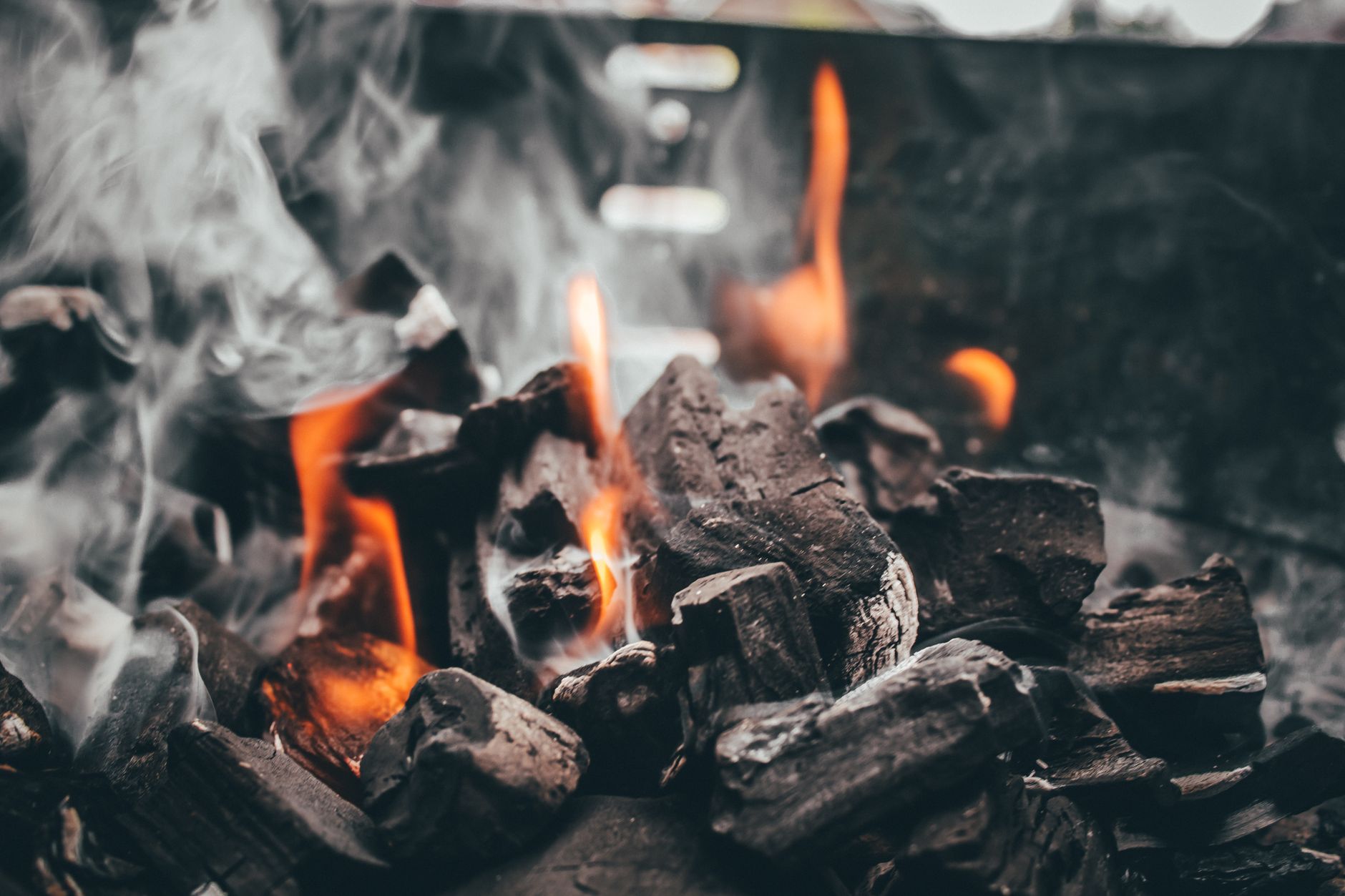 Charcoal glowing hot inside a grill