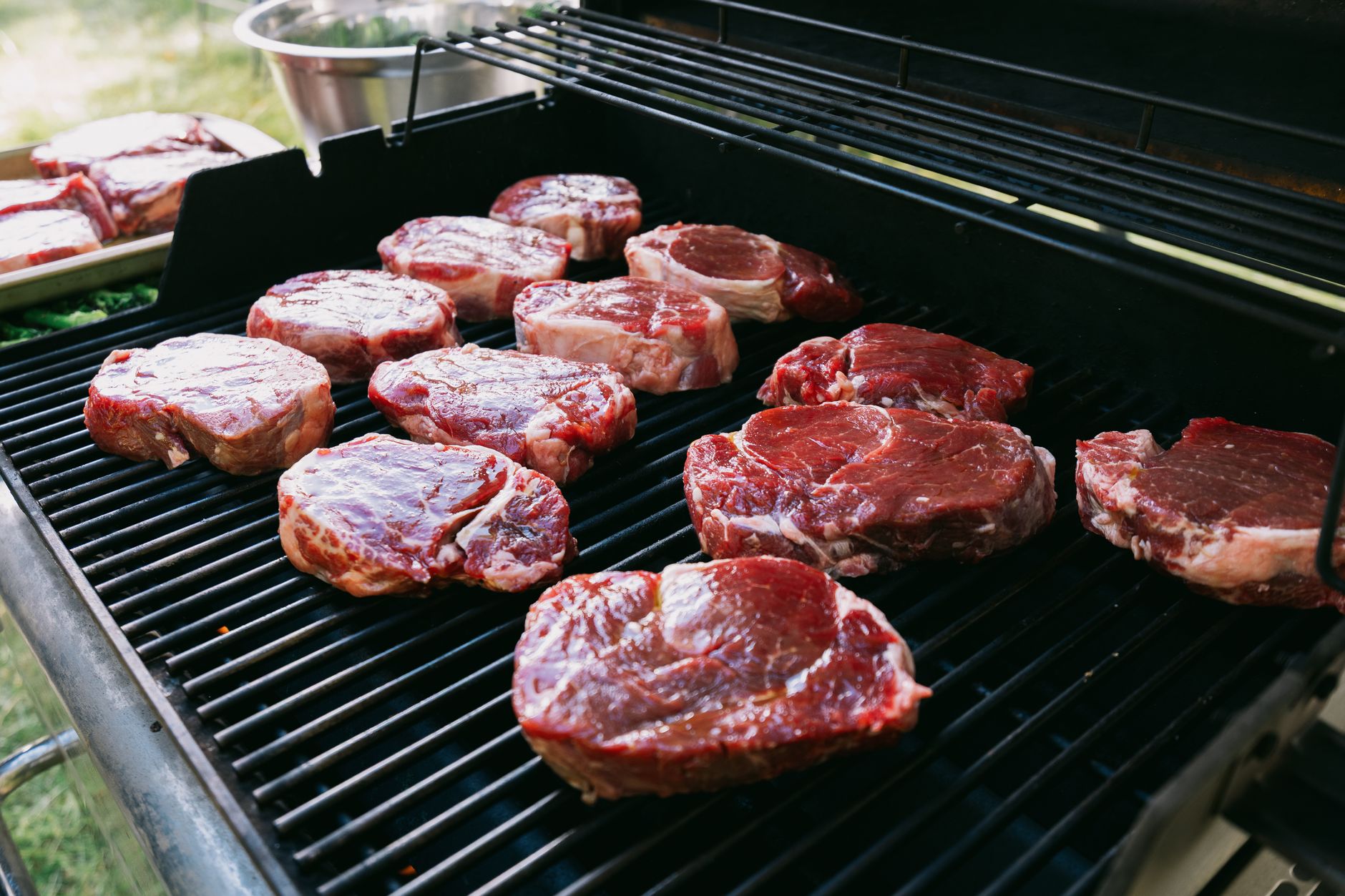 Steaks on a grill grate