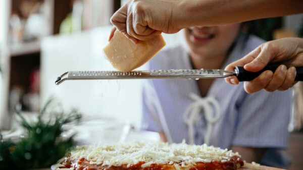 Best cheese grater: freshly grated cheese in a home kitchen
