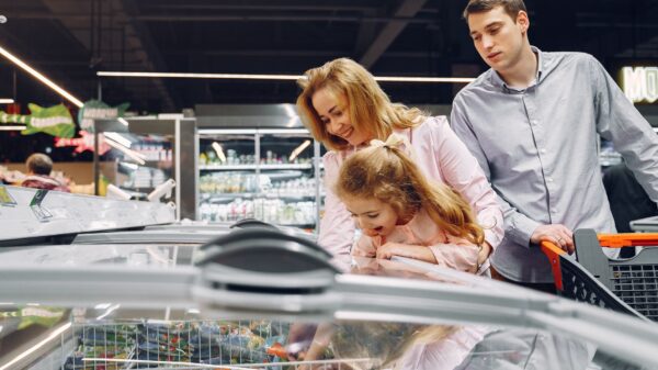 Best chest freezer: a family looking into a supermarket chest freezer