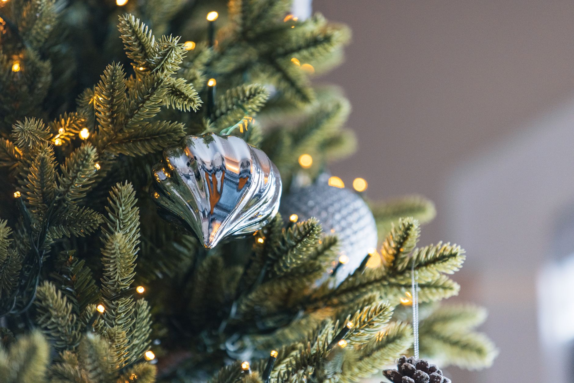 Ornaments on artificial tree branches