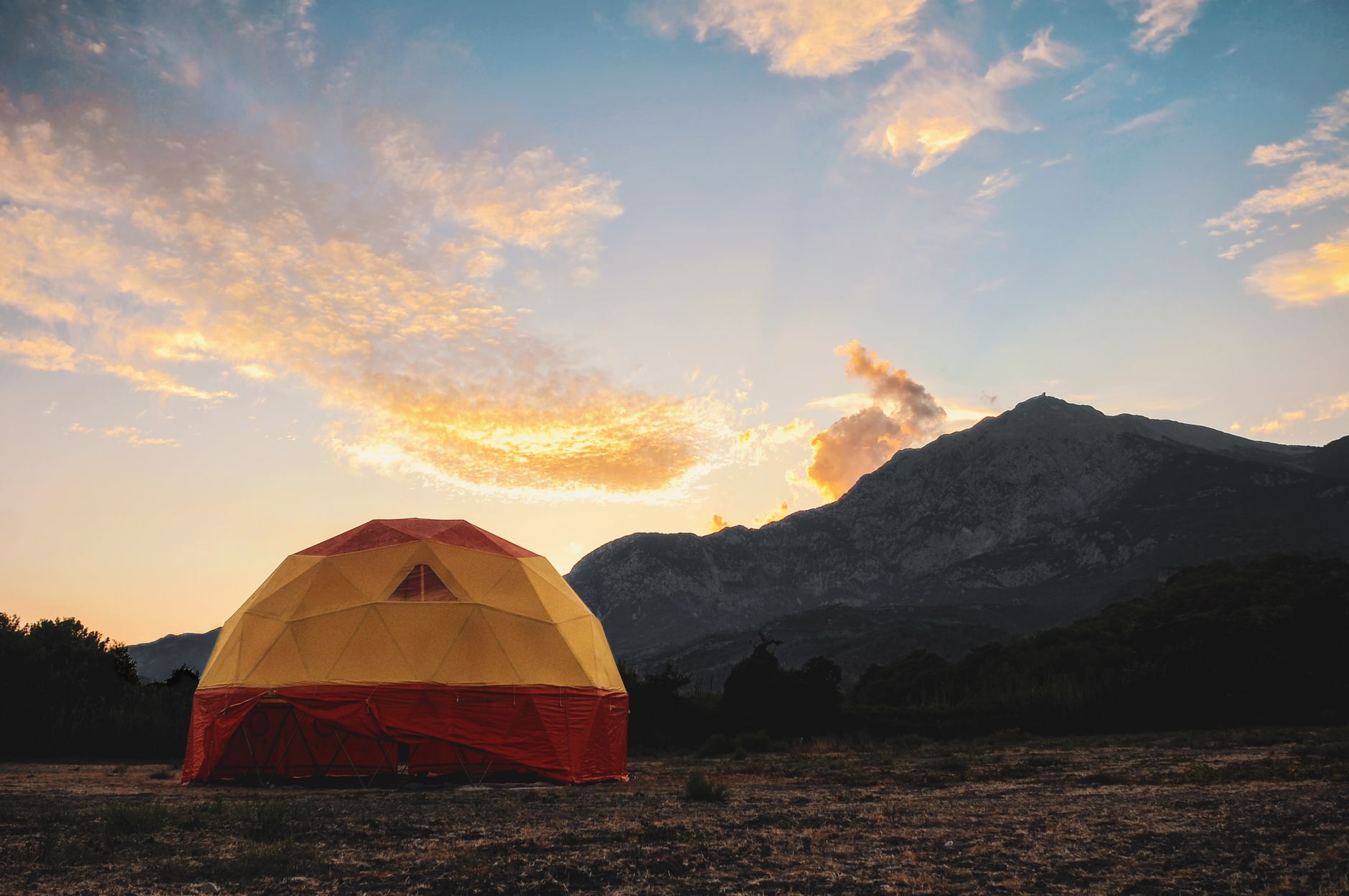 A tent at a campsite in the evening