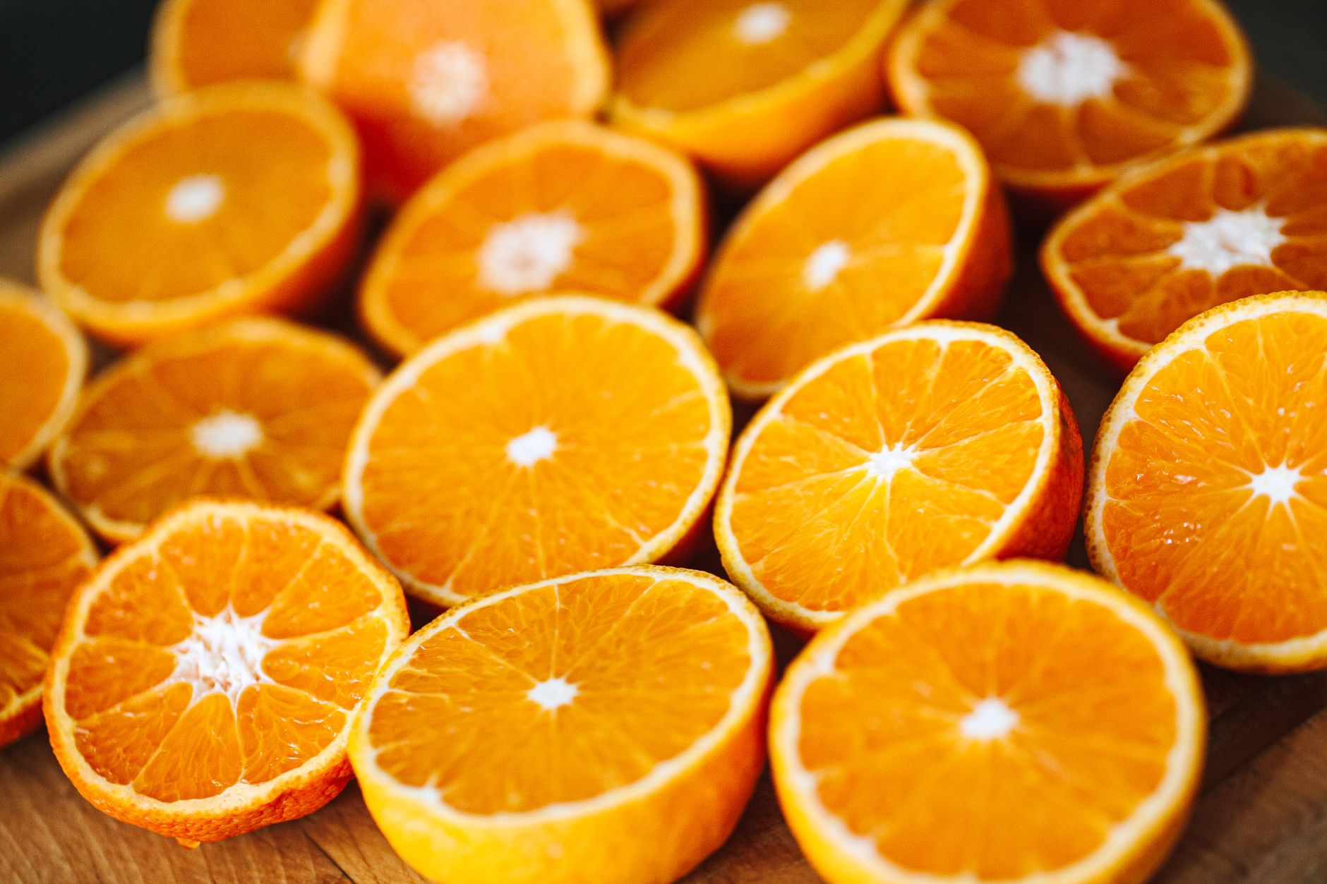 Rows of halved oranges