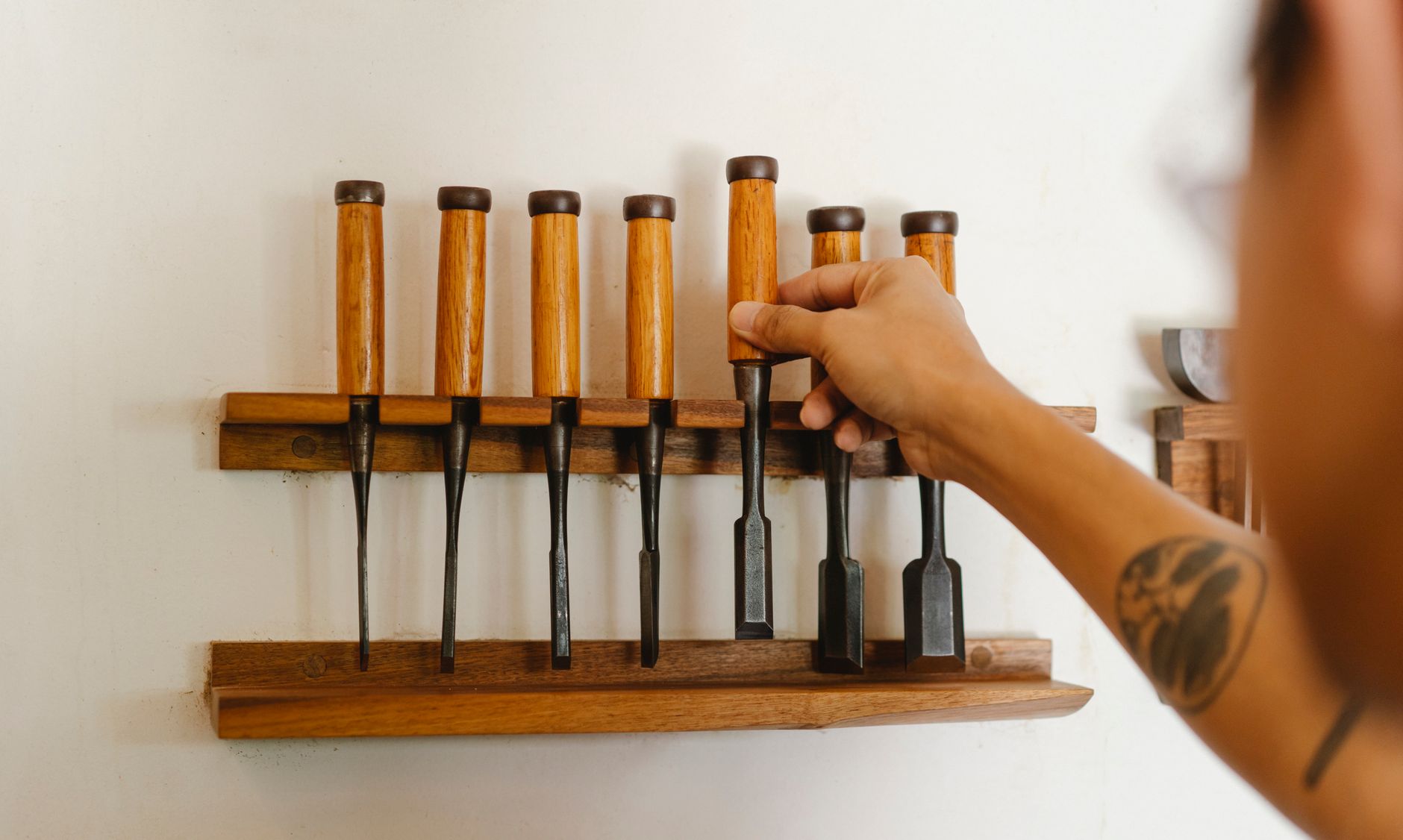 Hand tools hanging in a carpentry workshop