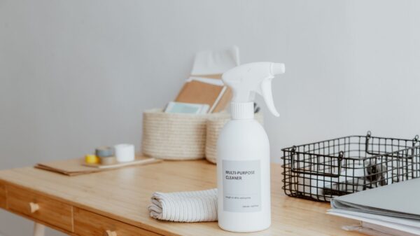 Best cleaning caddy: a spray bottle and baskets on a wooden desk