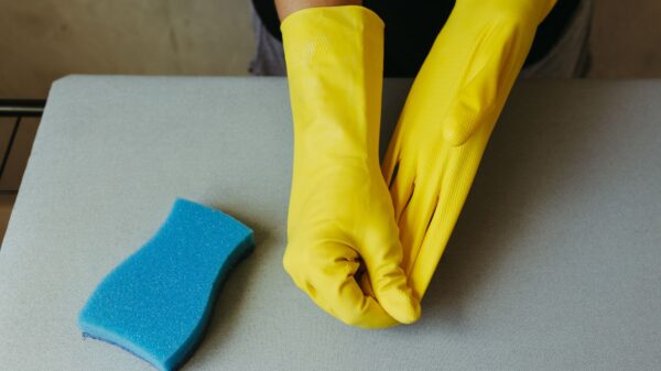 Best cleaning gloves: yellow rubber gloves and a sponge