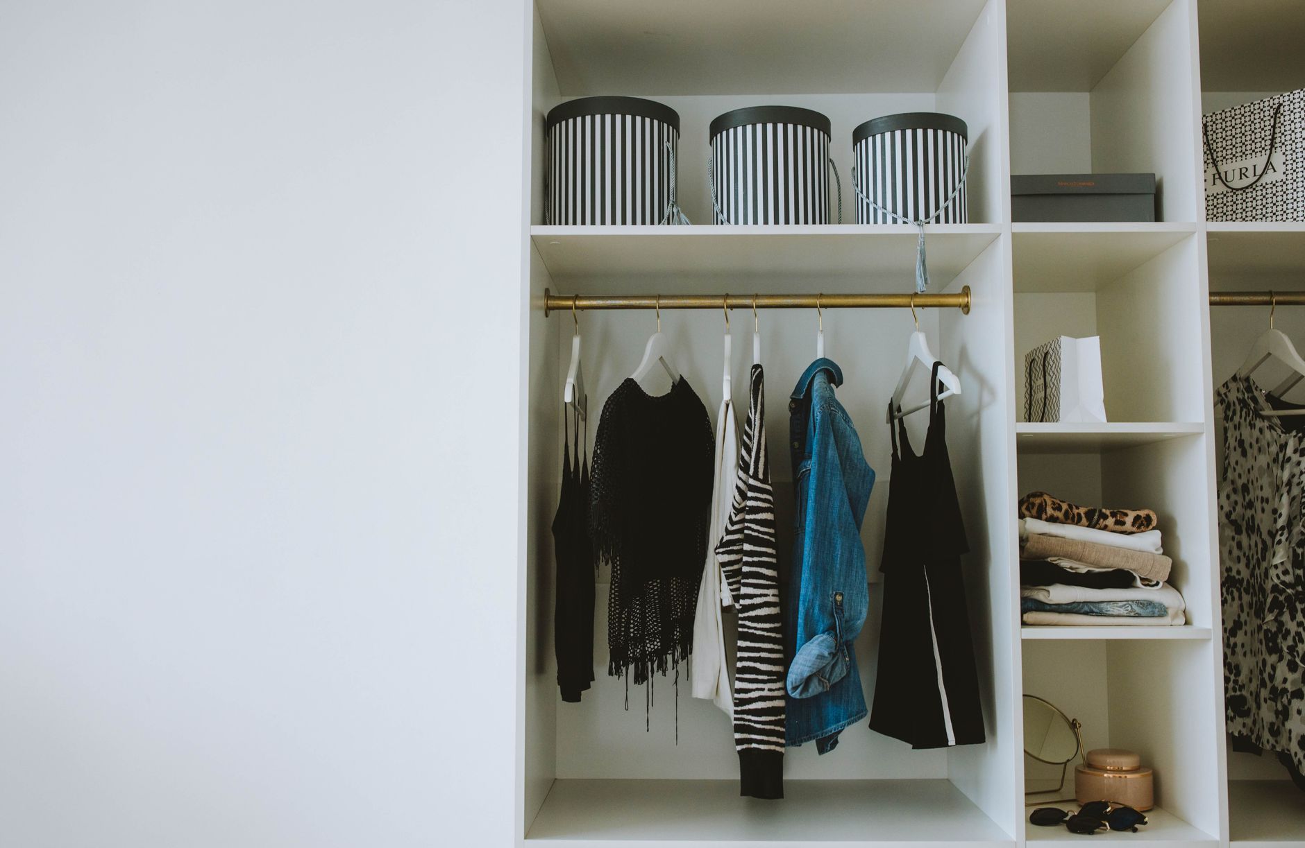 Best closet organizer: clothes hanging neatly in an organized closet