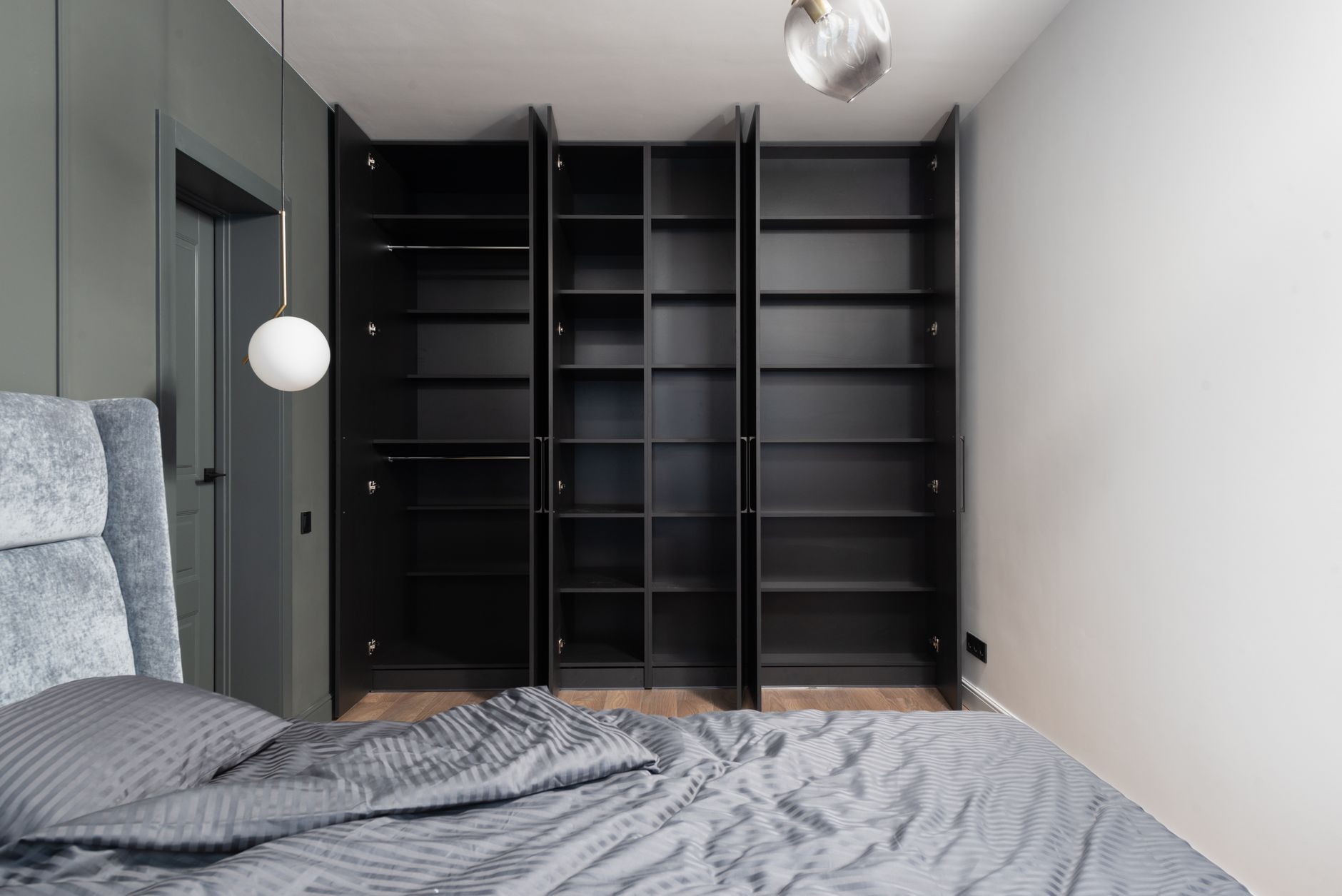 Open wardrobe shelves in a bedroom