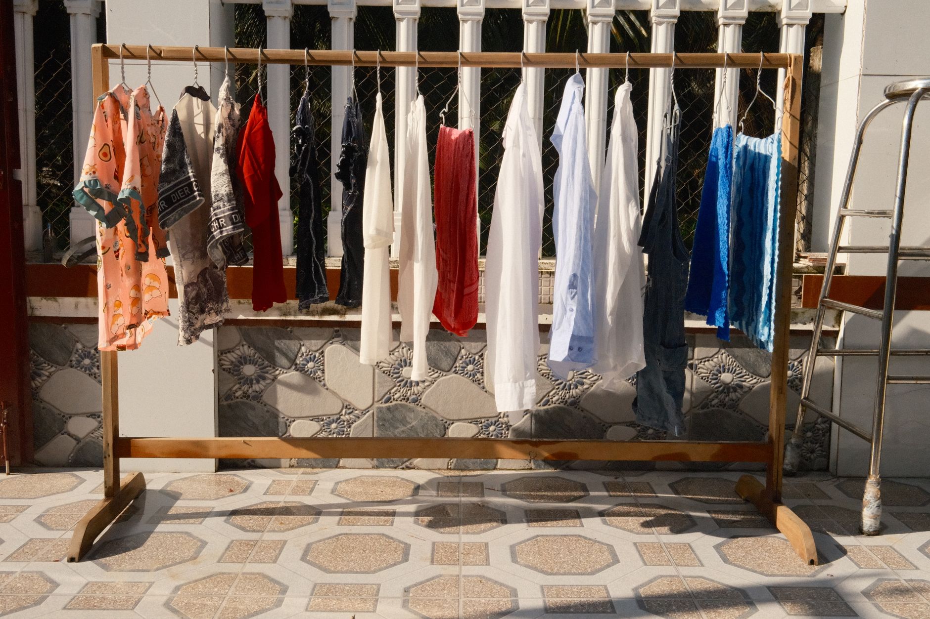 Clothes hanging on a wooden garment rack