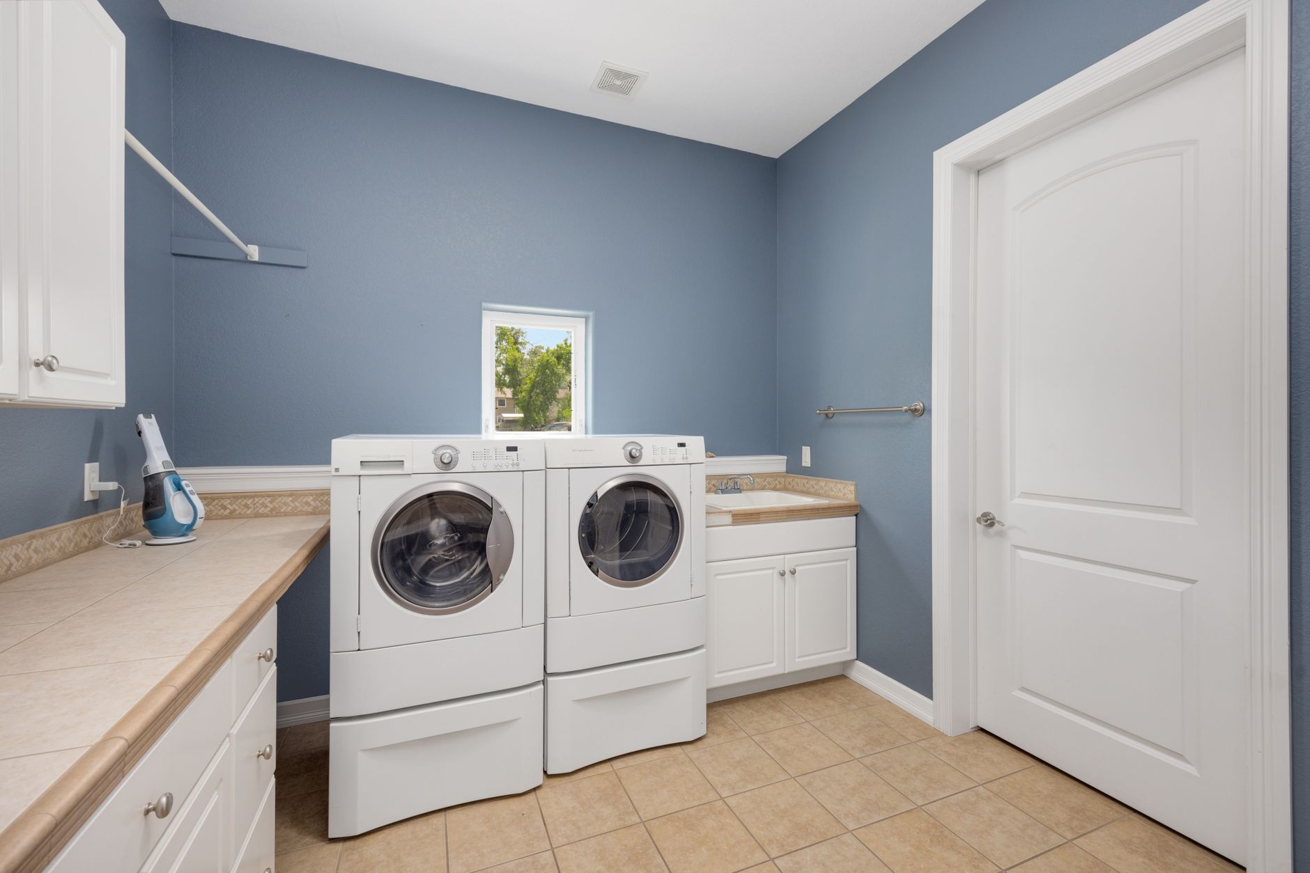 A laundry room with a washer and dryer