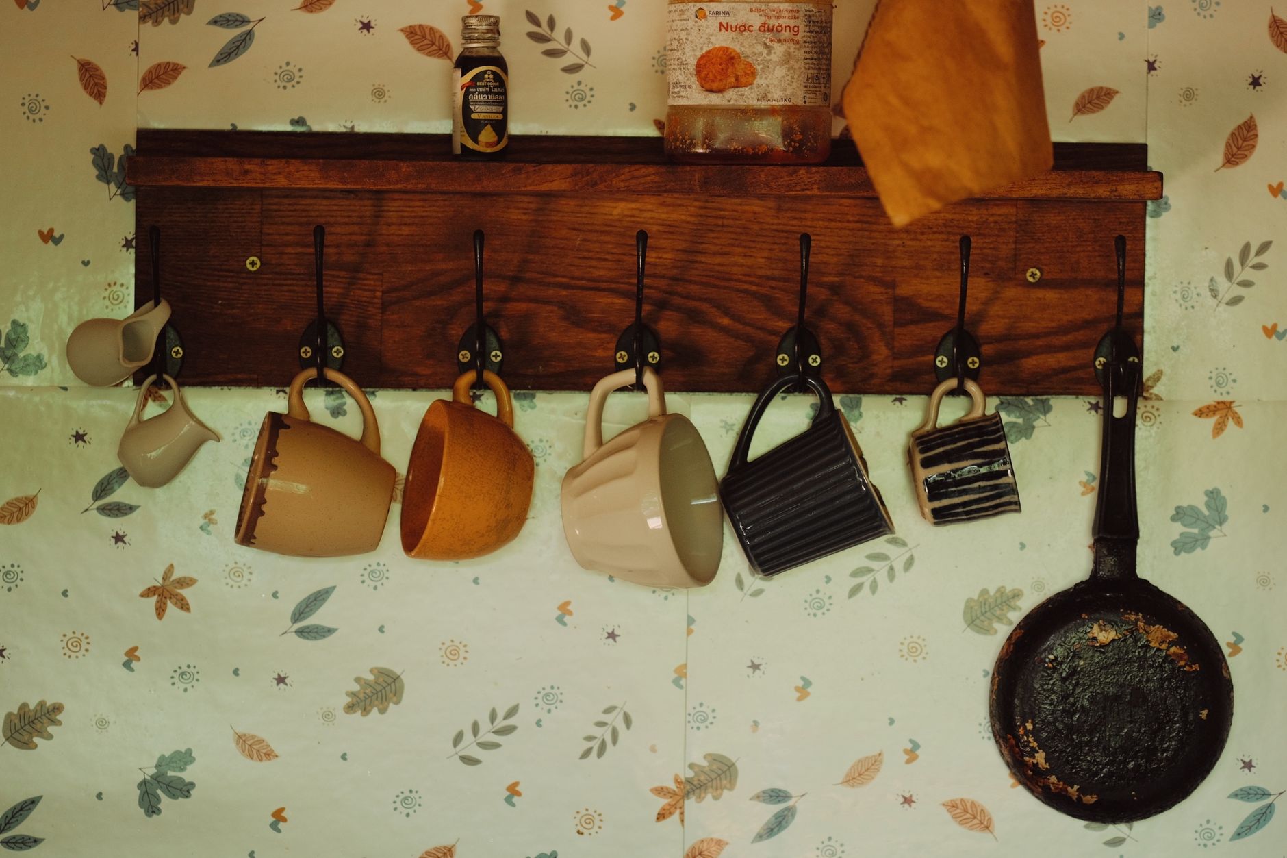 A wall shelf with hooks