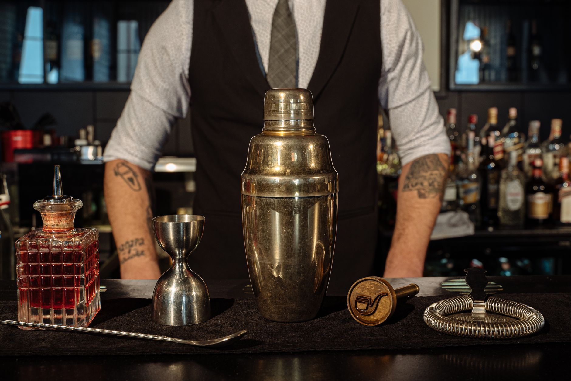 Best cocktail shaker: a steel shaker on a home bar counter