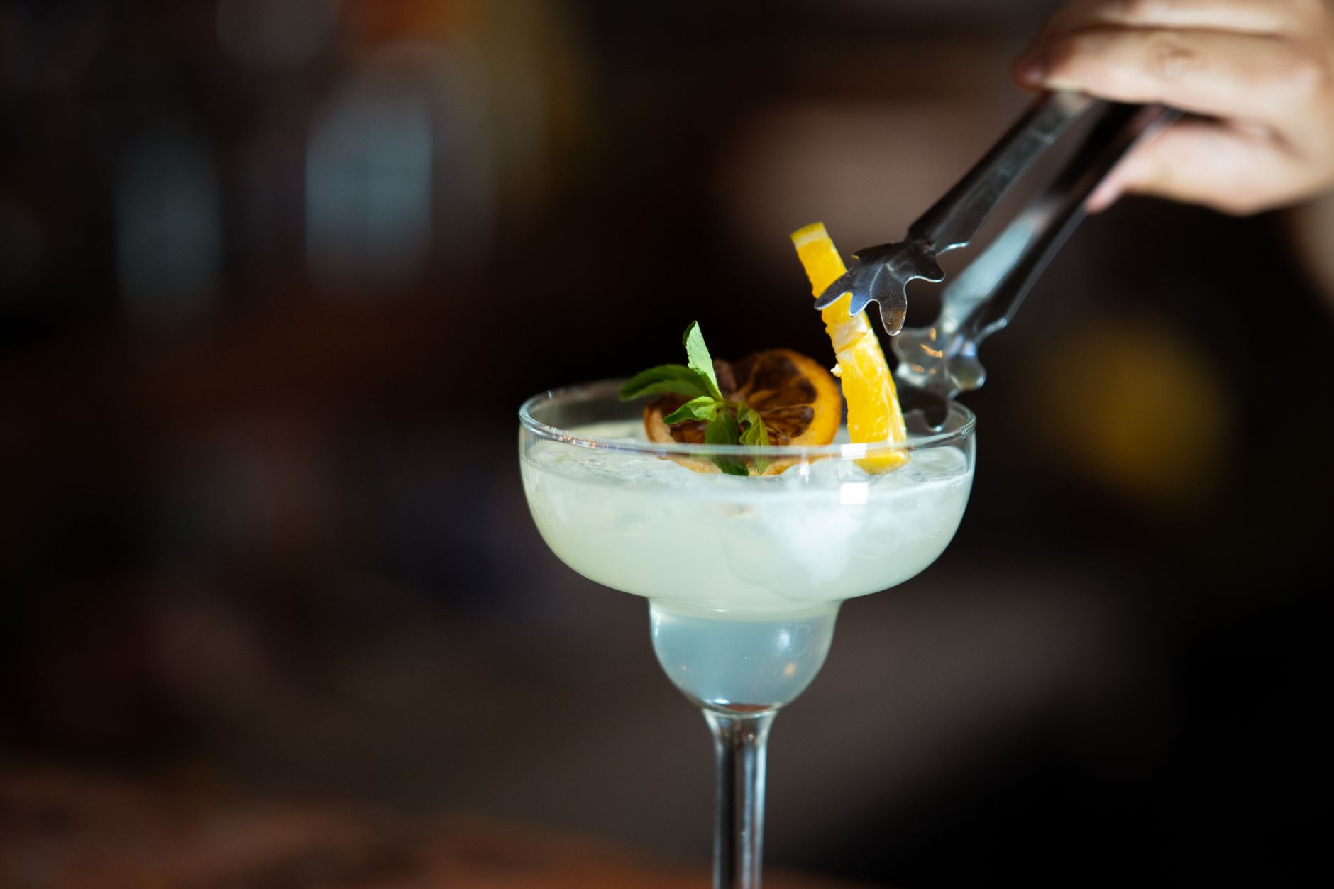 A cocktail garnished with citrus