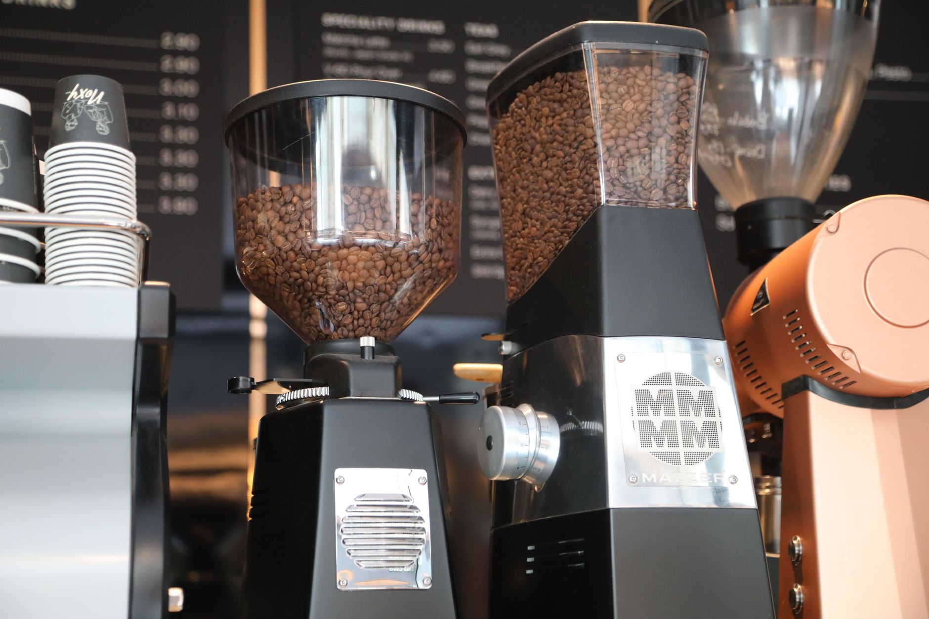 Best coffee grinder: burr grinders with whole coffee beans in their hoppers