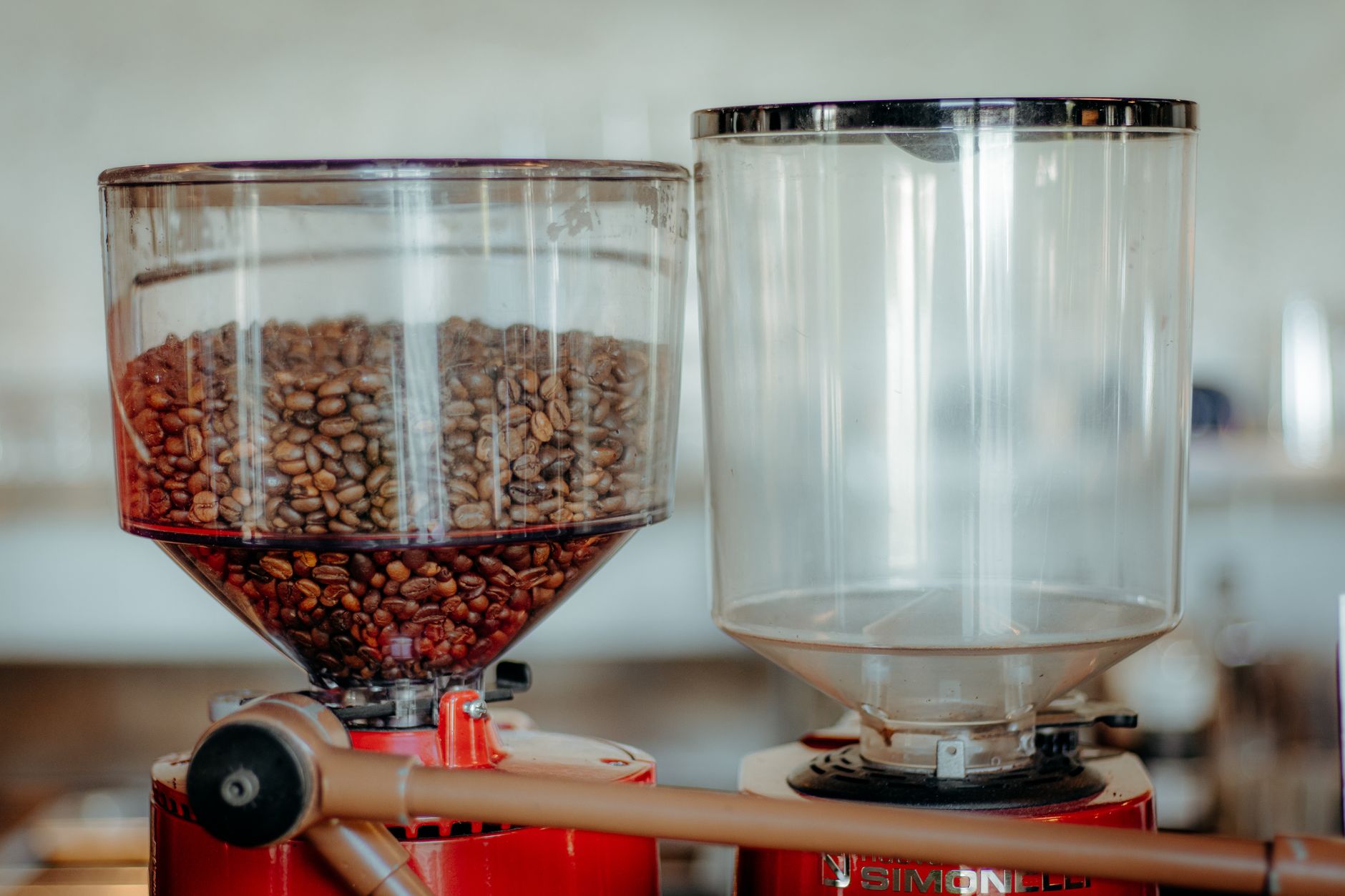 Coffee grinder hoppers filled with whole beans