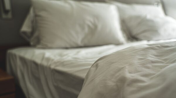A made bed with white pillows