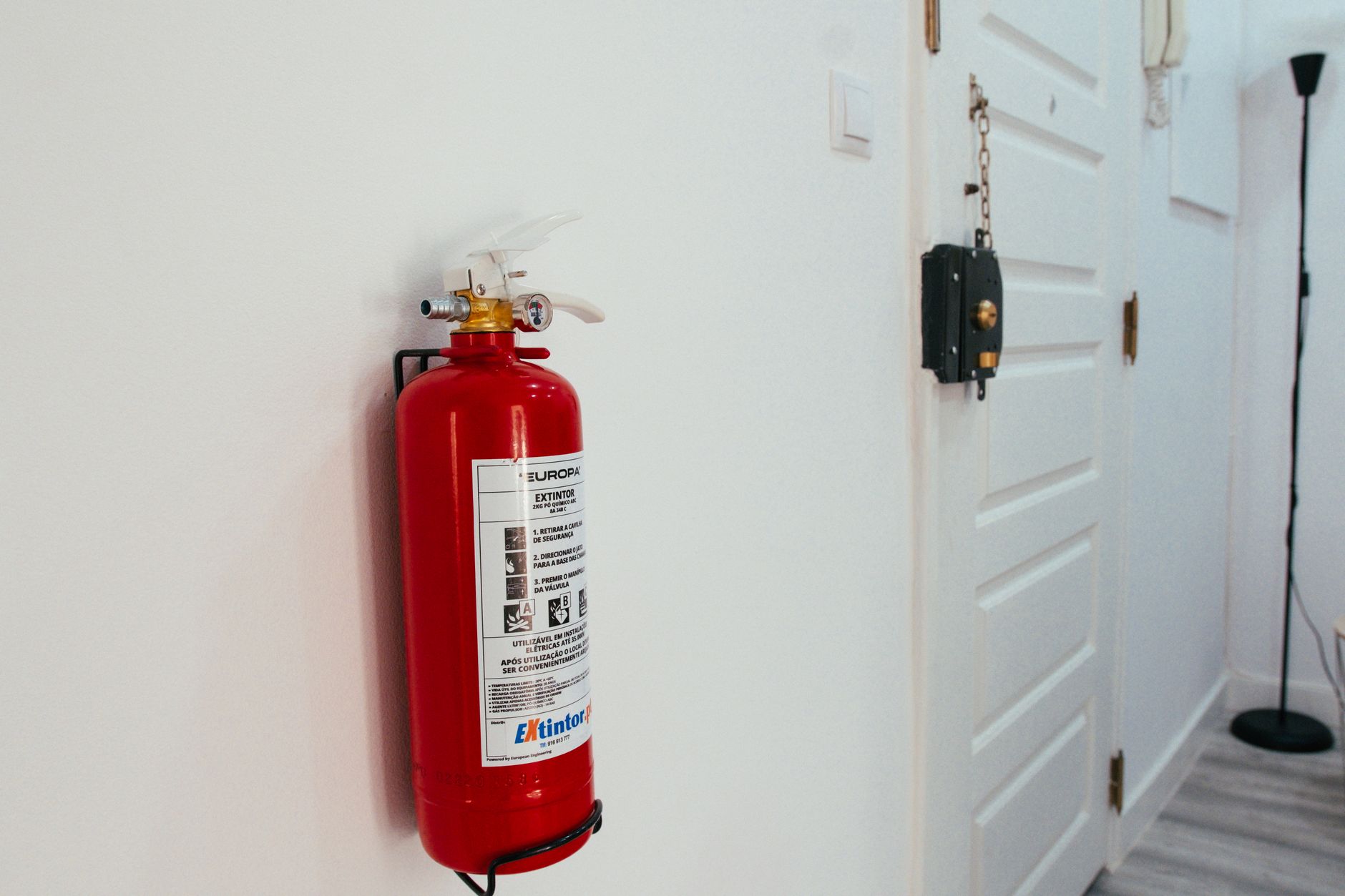 A fire extinguisher mounted on a wall