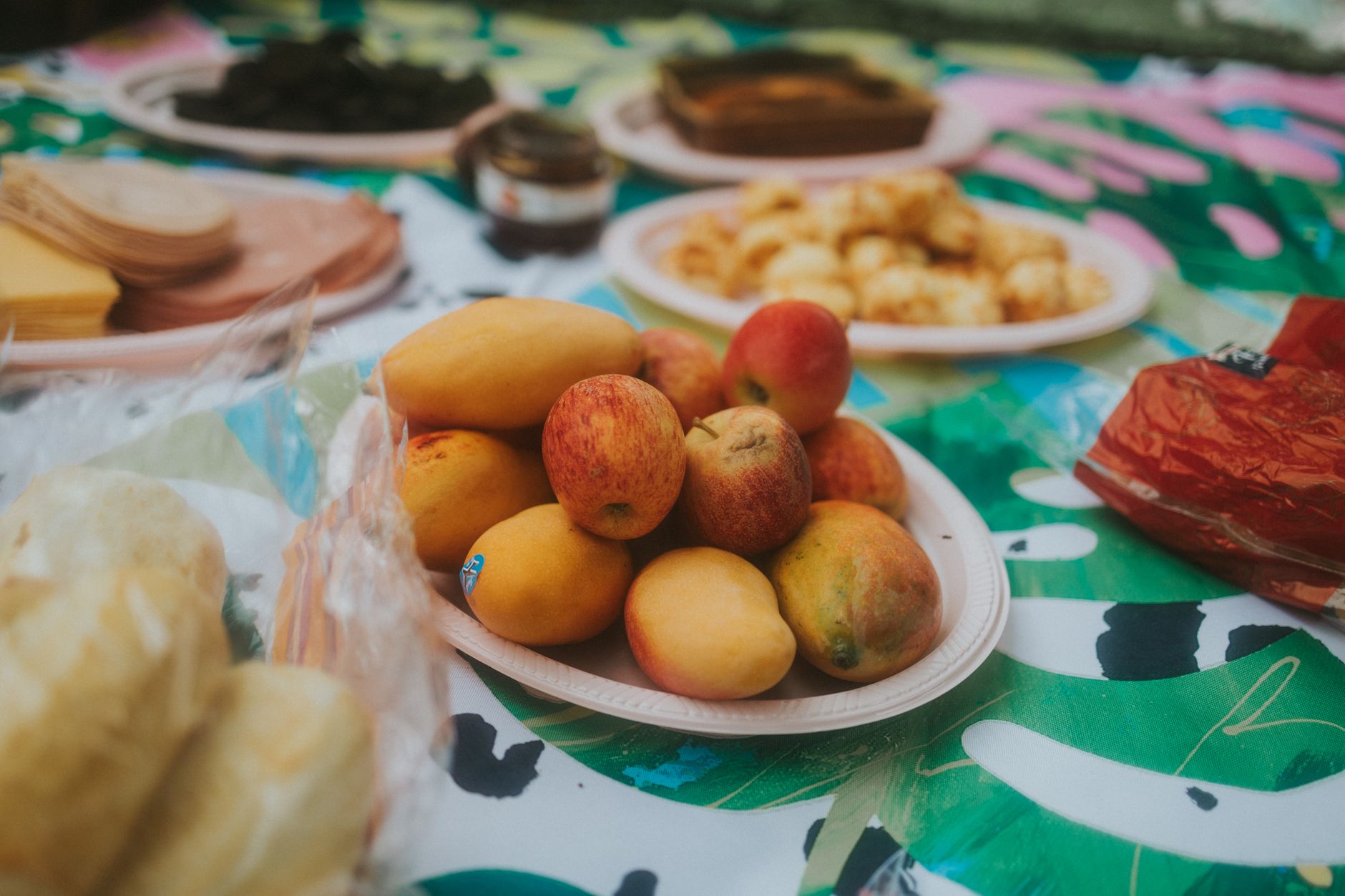 A picnic spread with fruit and snacks