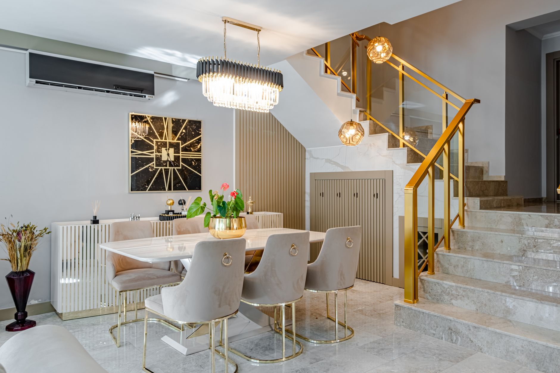 A chandelier hanging over a dining table