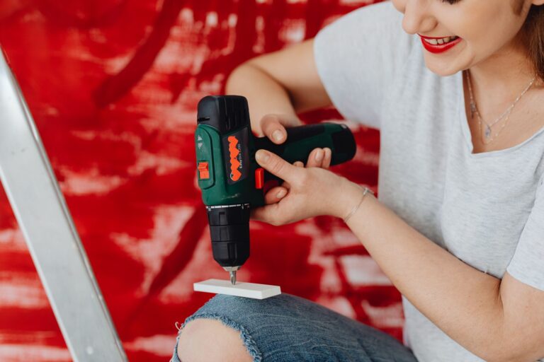 Best cordless drill: a battery drill on a wooden workbench