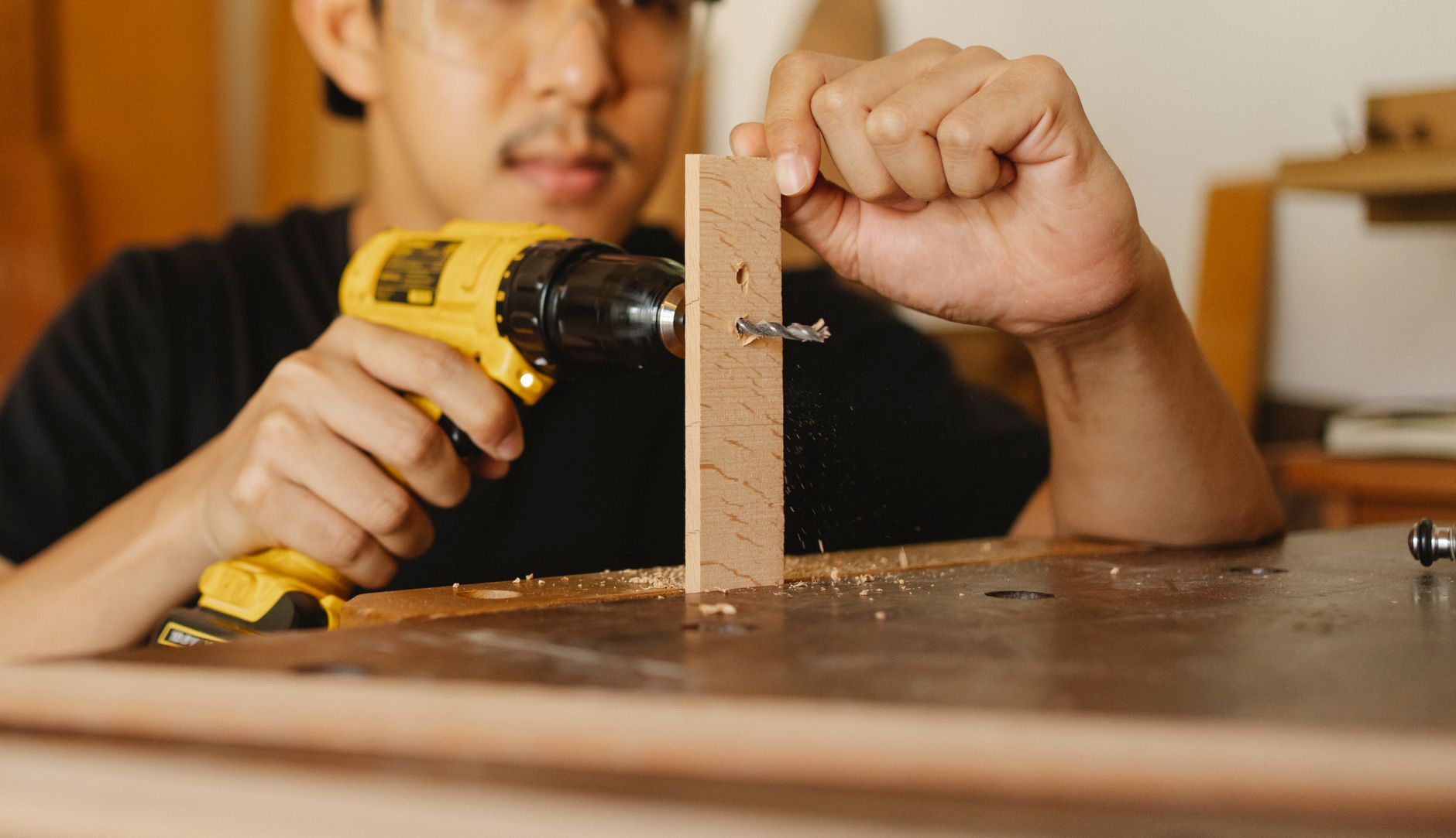 Driving a screw into a wood block