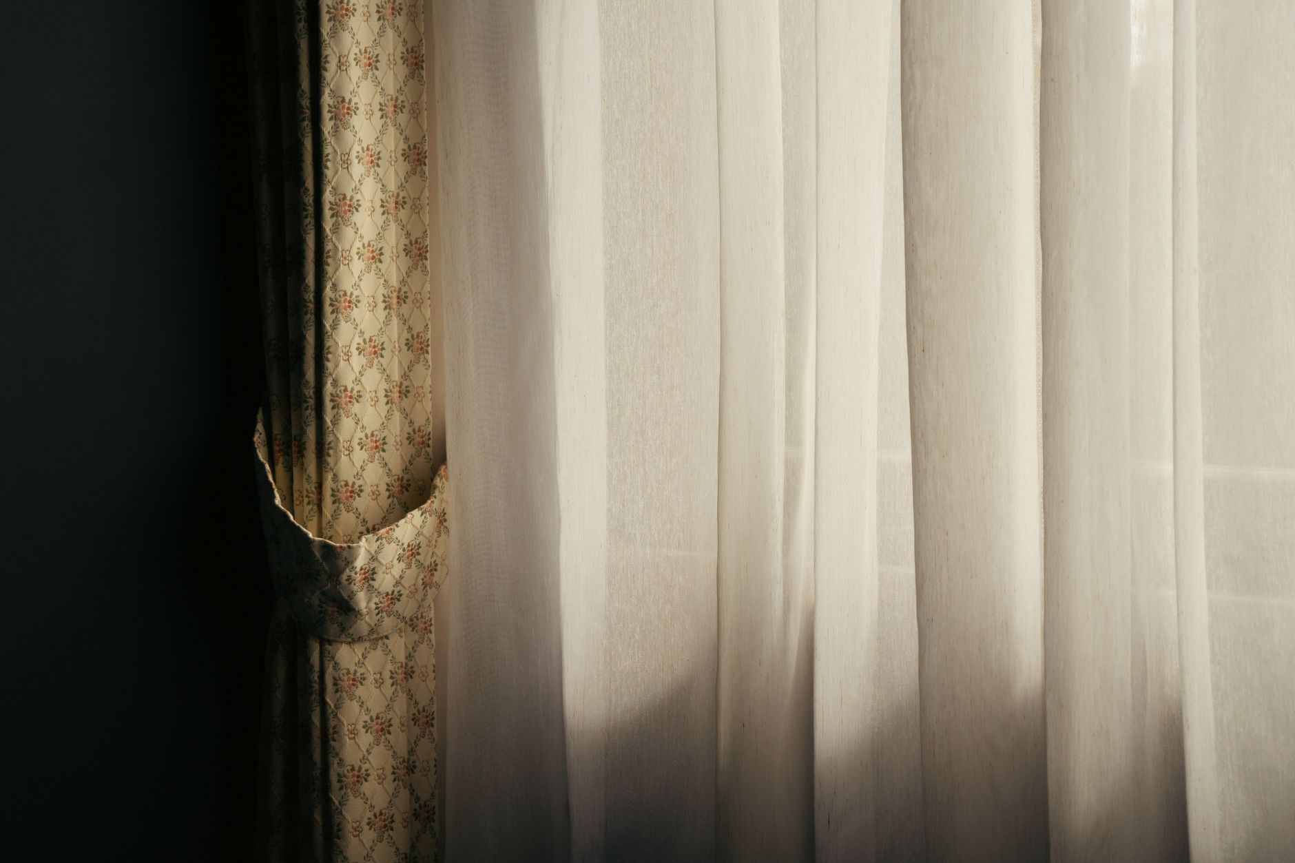 Sheer curtains letting in soft daylight