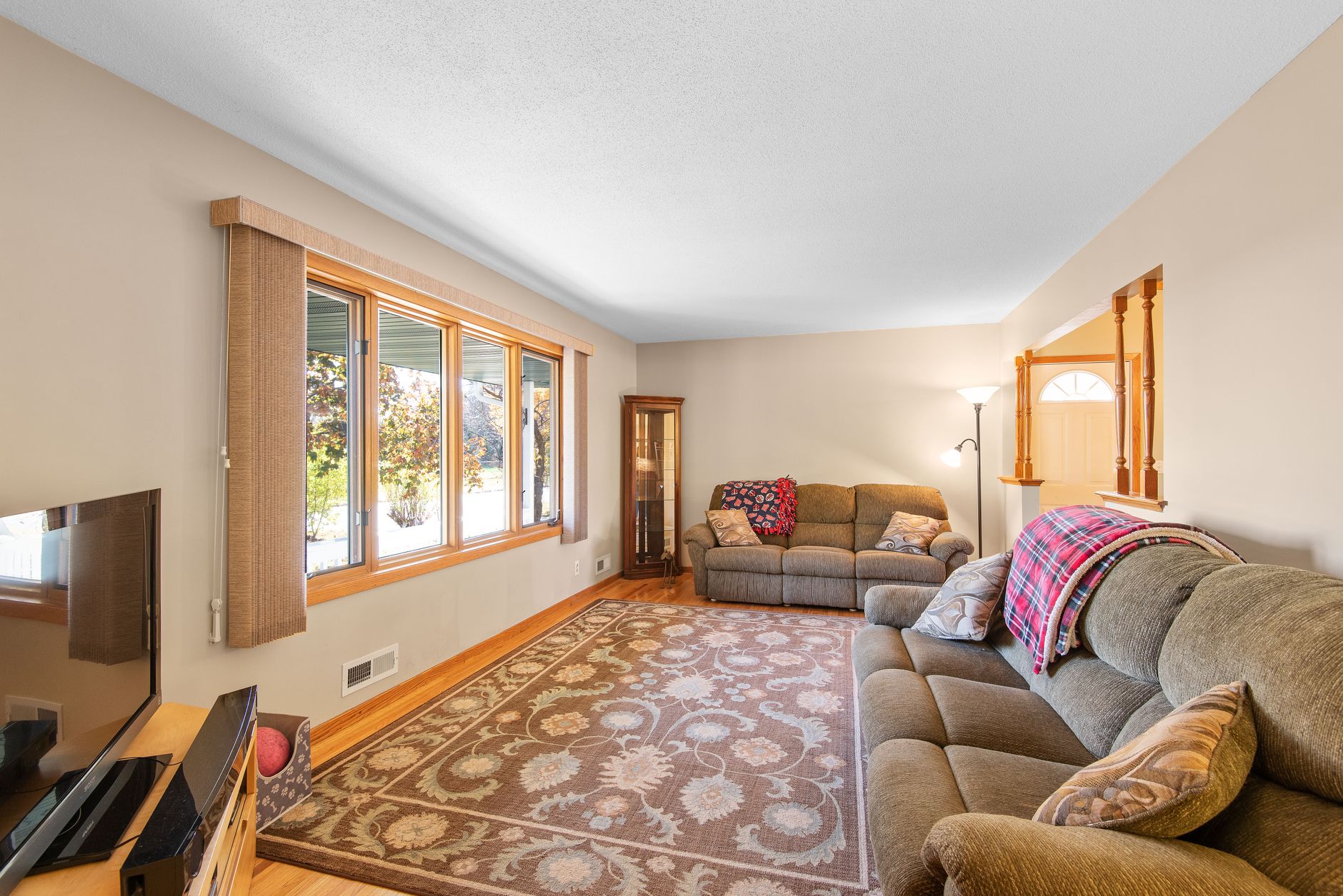 A wide window in a bright living room