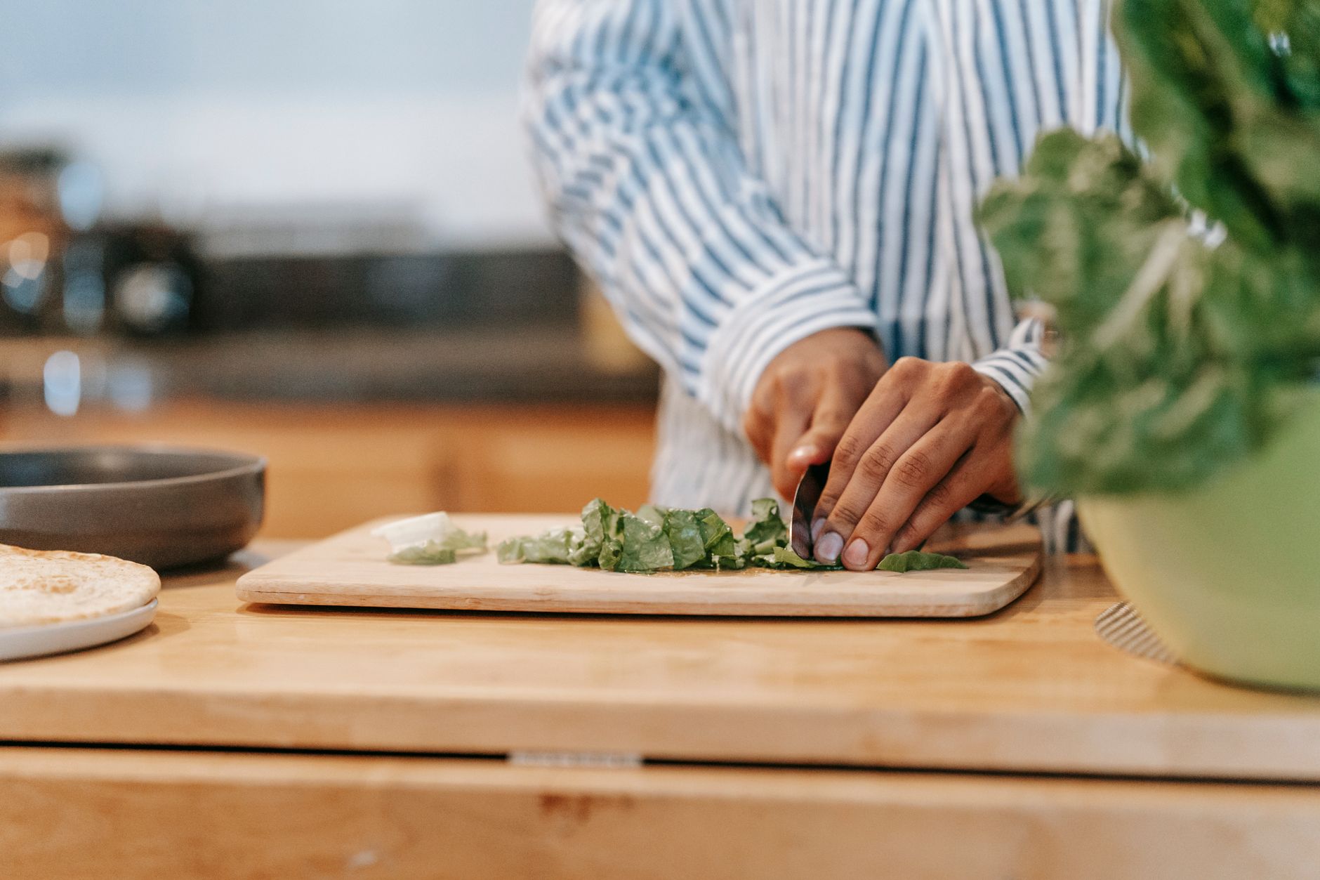 Chopping herbs on a wooden board