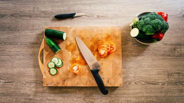 Sliced vegetables on an end-grain cutting board